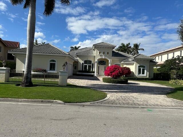This 5 bedroom, including private guest house, is located on one of the largest golf course lots in RPY&CC. The views are expansive. This home has 15-foot ceilings, and impact windows and doors throughout. Owner's suite has separate his and hers baths and closets. There are 3 additional ensuite bedrooms in the main house and another bedroom and bath in the guest house. Enjoy peaceful golf views while dining in the breakfast area. Additional areas to explore -office, family room, formal living and dining room. There is also a 3-car garage plus golf cart door.  Membership to the Royal Palm Yacht & Country Club is separate from homeownership. All dimensions are approximate, information believed to be accurate but not warranted, specifications and pricing subject to change without notice. All offers must include proof of funds. Buyer to pay documentary stamps, title insurance, abstracting charges, municipal lien fees and related title charge