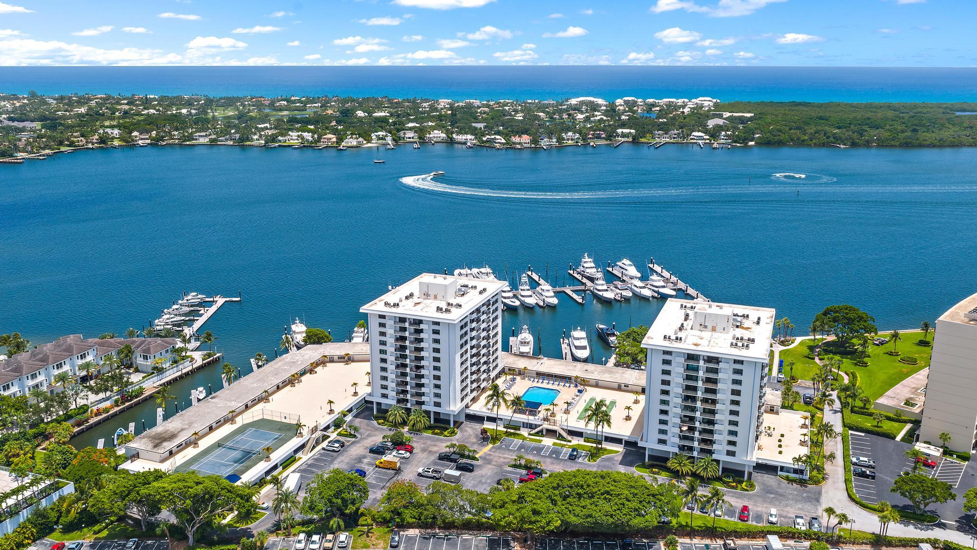 Experience exceptional waterfront living in the sought-after Admiralty at Old Port Cove in North Palm Beach. This residence is perfectly positioned along the Intracoastal Waterway, offering spectacular sunsets from your private penthouse balcony. Being sold fully furnished and turnkey ready for immediate enjoyment~Just bring your suitcase. Located within a gated, 24-hour manned community on a 60-acre peninsula, Old Port Cove is renowned for its resort-style lifestyle and marina-front setting. Residents enjoy access to a full-service marina, waterfront restaurant, two-mile scenic walking path, and beautifully maintained grounds. The Admiralty offers spacious residences with terraces designed for indoor-outdoor living, along with amenities that include a heated waterfront pool, tennis court, social areas, and secure garage covered parking. Ideally located just minutes from world-class golf at North Palm Beach Country Club, fine dining, shopping along PGA Boulevard, and pristine beaches, this property delivers the perfect blend of privacy, convenience, and coastal living.