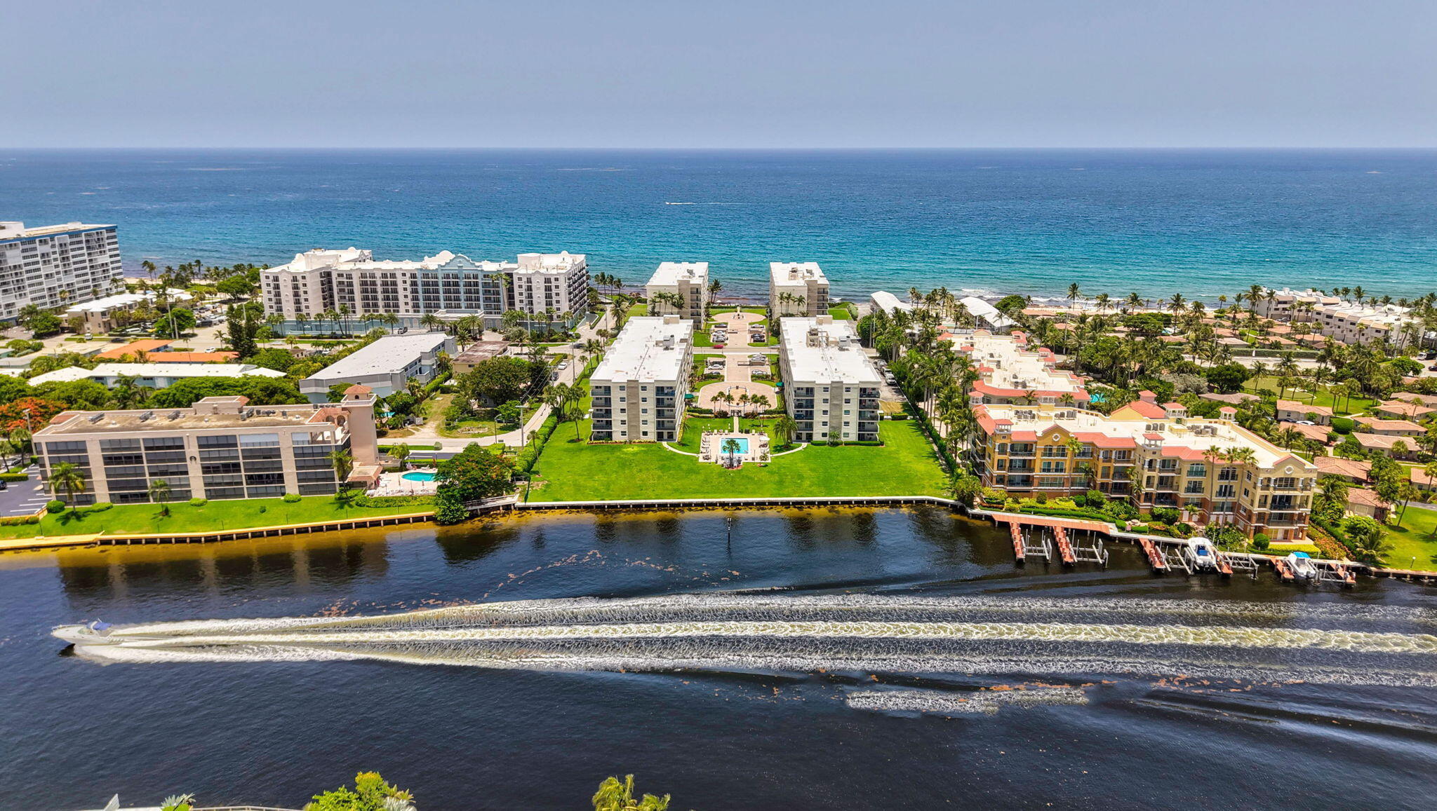 Welcome to this COMPLETELY UPDATED coastal style corner waterfront condo located in Port de Mer Condo on the prestigious Hillsboro Mile.  This 2 bed/2 bath residence offers 1,270 square feet with an open floor plan and split bedroom layout. Enjoy refreshing tropical breezes and beautiful ocean views from your covered balcony.  Walkable to restaurants and shops in Deerfield Beach and close to Pompano Beach as well. Spacious Primary bedroom with walk in closet , fireplace and also has a private balcony to enjoy the sunset views and intracoastal! Relax in one of the 2 pools on the intracoastal or ocean or have a cookout with the outdoor grills & tables with umbrellas available on the pool deck!  1 pet allowed max 20lbs. New roof 2023, impact windows throughout - must see!