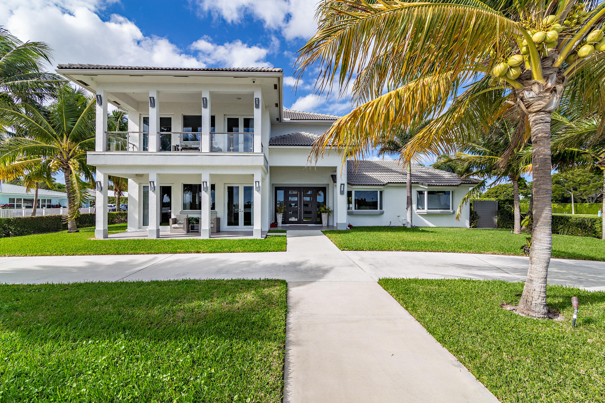 Built in 1999 yet completely renovated and redesigned this home incorporates 6,700 total square feet under roof and approximately 5,858 under air. Featuring 5 bedrooms and 4.5 bathrooms this newly appointed contemporary interior home is move-in-ready.  The master bedroom suite is situated on the easternmost part of the second floor and has wide Intracoastal views while incorporating a large walk-in designer closet, vaulted ceilings and state of the art bathroom.  As a bonus, this home has an attached mother-in-law/ nanny suite on the 2nd floor which is perfect for guests, older children or live-in assistance. Included with this sale are the dock and the 2 boat lifts across Flagler Drive. Close to area beaches, Worth Avenue shopping, fabulous dining and the magical Flagler Drive bike path.