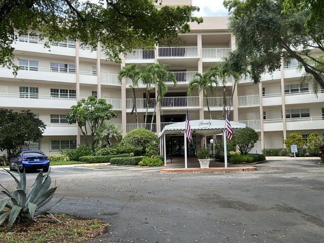 Welcome to your dream golf-course retreat! This stunning ground-floor corner unit offers 3 spacious bedrooms & 2 elegant baths across 1390 sq ft of refined living. Bask in serene golf-course views from your sunlit, window-lined, screened patio. As a first-floor unit, enjoy the convenience of two entrances. Inside, find a blend of tile & laminate flooring, with a freshly renovated guest bath. Hurricane shutters provide peace of mind, and a separate storage unit offers extra space. The building's pool and clubhouse - complete with SAUNA,  kitchen & BBQ area - are just steps away. In addition, outdoor gym facilities, tennis courts & pickleball courts are all within a short walking distance. This is Florida living at its absolute finest! Don't miss the chance to make this gorgeous home yours! 1ST FLOOR! CORNER UNIT! FULL SIZE WASHER AND DRYER INSIDE UNIT. SPLIT FLOORPLAN. EAT-IN KITCHEN. PLENTY OF GUEST PARKING.