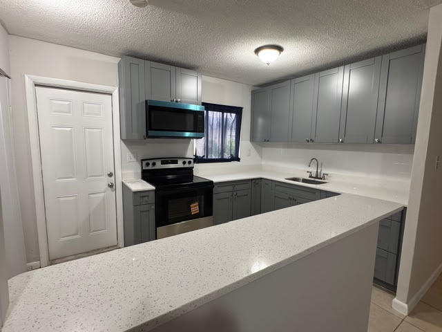 2 Large Bedrooms with walk in closet, additional large closet in hallway which can be used for a den. Fenced back yard and 4 parking spaces. Great location near Atlantic Blvd and I 95. Recently painted and ready to move in. Great location.