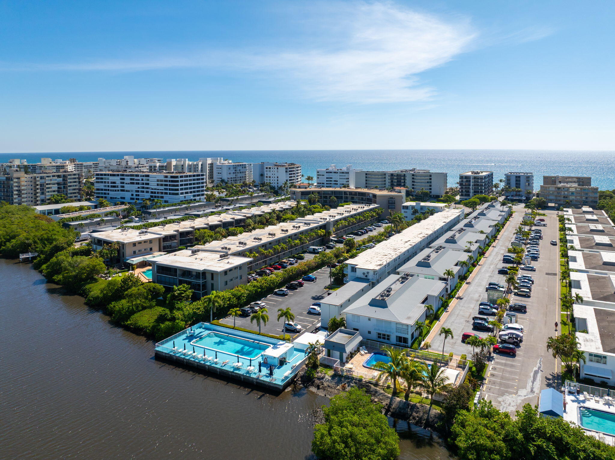 Discover your slice of paradise on South Palm Beach Island! Priced at just $94,000, this charming studio offers 375 sq ft of cozy living space, perfect for a personal retreat or investment opportunity. With serene views and unbeatable location, it's the ideal escape.   Fabulously located between the Atlantic Ocean and the Intracoastal, enjoy a short walk or bike ride to Lantana Beach, Publix, the Eau Resort & Spa, and Plaza del Mar shopping. Residents enjoy a boutique active lifestyle  that includes a secure lobby with dedicated bike storage, and a dedicated area featuring picnic tables and BBQ grills, perfect for waterfront social gatherings. Relax by the renovated, heated pool directly on the Intracoastal or take advantage of private beach access across the street. Land is included.  - Ground floor unit.   - Active Lifestyle: Community Lobby, Social Gathering Room, Secure bike storage to facilitate a healthy, car-optional island lifestyle.  - Outdoor Amenities: Waterfront social deck with picnic tables, BBQ grills, and a heated pool sitting directly on the Intracoastal.  - Prime Location: "On the Island" in South Palm Beach, walking distance to the new Publix and local favorites like the Ice Cream Club.  - Parking: Assigned parking space conveniently located just steps from the unit's private patio entrance.  - Storage: Extra storage locker included.  - Strict Community Standards: This is a quiet, well-managed, owner-occupied building with a no-pet and no-leasing policy.   Note: Cash only per co-op rules; no pets, no leasing, and mandatory board interview/background check required.