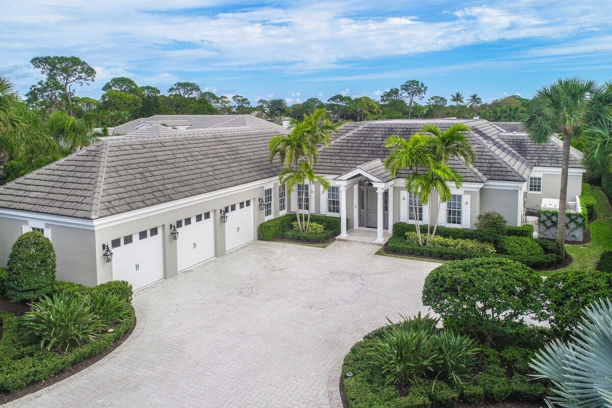 Featured in Florida Design magazine, this striking, fully renovated residence is a masterclass in design and luxury. Set on over half an acre of meticulously landscaped grounds, this exceptional property includes a spectacular four-bedroom, four-bath main house and a two-bedroom, two-bath guest house, perfectly connected by an expansive outdoor living area.
The centerpiece of the property is the 54-foot European edge pool, complete with a sun shelf, lap current, and spa. Adjacent to the pool, a 500-square-foot veranda offers the perfect setting for outdoor entertaining, featuring a gas fireplace, a 65-inch smart TV, and a window that opens into the guest house kitchen. The adjoining grill area makes this outdoor space ideal for al fresco dining, and electronic storm shades ensure comfort in all weather. The main house boasts an open-concept kitchen, breakfast area, and great room, with French doors leading to the covered porch and outdoor entertaining space. The gourmet kitchen is a true showstopper, equipped with top-of-the-line Thermador appliances, a 10-foot white marble breakfast bar, and a center island that adds both beauty and functionality to the space. The great room is equally impressive, with vaulted ceilings, a limestone fireplace, and a custom-built bar area hidden behind folding pocket doors. The guest house offers an additional level of sophistication, with two well-appointed guest suites, a full kitchen, and a living room featuring custom cabinetry and a wine cooler.
Equipped with a full-house generator, combined four-zoned A/C systems, and an air-conditioned two-car garage that also accommodates two golf carts. No detail has been overlooked, with both residences showcasing Roberto Cavalli porcelain floors, exquisite millwork, custom cabinetry, solid core doors, a Lutron system with Savant smart home technology, custom ceilings, and built-in closetsall carefully crafted for both style and functionality. This unparalleled estate offers the ultimate in luxury living, with every aspect designed for comfort, elegance, and entertaining.