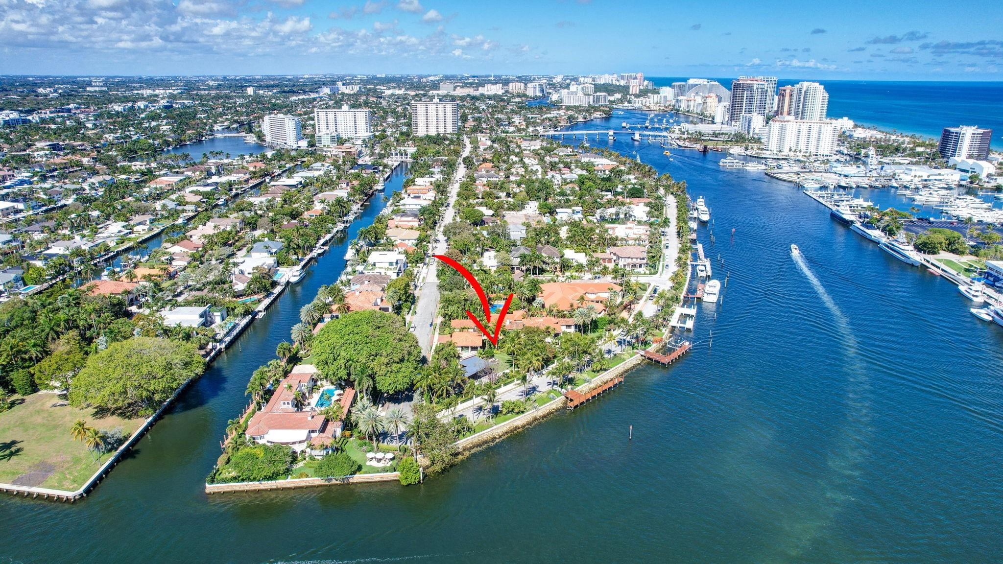 Magnificent two-parcel .82 acre Idlewyld waterfront estate with over 14,000 sf in total. Ultimate deep water compound! 338ft+/- straight-line waterfront (no wake) with two docks. Main house 6,336 sf under air with 2,050 sf covered outdoor living off Chef’s kitchen, fully renovated and expanded in 2012 with option for apartment over garage. In 2018, guest house with pool pavilion added, 1,330 sf under air plus 2,504 sf terraces with dining bar for 18, caterer’s kitchen, cabana, gym, and office. Estate includes 2,029 sf of air-conditioned garage space for seven cars. Walled and gated for privacy, award-winning grounds and rare tropical landscaping surround two pools and spa. Timeless Marc Michaels design with custom detailing and high-quality finishes throughout. Most desirable & extremely private South end of Idlewyld Drive. Estate is entirely walled & gated, creating a Four Seasons type environment that must be seen to be appreciated! Main House 815 Idlewyld Certificate of Occupancy with 2012 renovation which included entire Primary Suite with separate baths & closets, plus large private balcony intracoastal facing. 2012 new roof over entire main residence & all air conditioners replaced in last 12 months. First Level: formal living room with gas fireplace & covered front terrace overlooking the intracoastal. Separate bar area with 1,000-gallon saltwater live aquarium. Back-lit custom onyx bar, ice maker, refrigeration & storage. Overlooks the totally private courtyard pool (one of two pools).Elegant & welcoming formal dining room (access to pool area), custom wine refrigeration & storage. First level bedroom suite 1, library/home office (potentially bedroom suite 2)Cabana bathroom off the 2,000 sf covered outdoor living area/terrace with Summer Kitchen, grill & refrigeration, cabana bathroom & outdoor shower. Easy access to garage for caterers. 4 bay garage includes 1 lift. Potential apartment over garage for housekeeper or boat captain. Totally private & heated court yard pool with spa. Second level comprises loft area, primary suite, club room & bedroom 5 suite. Club room (potential VIP bedroom suite 4) with acoustic soundproofing built-in, including large projection theater with automatic/motorized black out shades & private balcony. Bathroom with sauna - potential to be a VIP bedroom suite & included in bedroom count. Expansive & ultra-luxurious primary suite offers private intracoastal facing balcony, separate spa style baths and custom closets/dressing rooms.833 Guest House & Pool Pavilion - Award Winning Architectural & Landscape Design Incredible intracoastal views while still enjoying privacy! Professional landscape lighting, outdoor speakers & fountains. Connected by wide open lawn areas & surrounded by tropical landscaping. Covered area includes water feature & secondary splash pool/spa. Stunning bar seats 18 with refrigerator, sink & storage.. Dining loggia with seating for 14, all covered with beautiful, beamed ceilings to create a tropical & private resort oasis. Large separate BBQ area separate to bar. The Guest House offers a full caterer's kitchen, cabana bath & access to the additional 3 car garage (potential 7 car when garages are combined). Stair access to second level of Guest House, terrace opens to gym and home office, both with amazing views. Spa style bathroom. Potential for additional bedrooms if required. DOCKS - Two separate docks, 70' & 90' both with 100amp/2 x 50 amp service 17,000 lb boat lift. Please note approximate measurements obtained from the builder & should be verified by the buyer for accuracy.