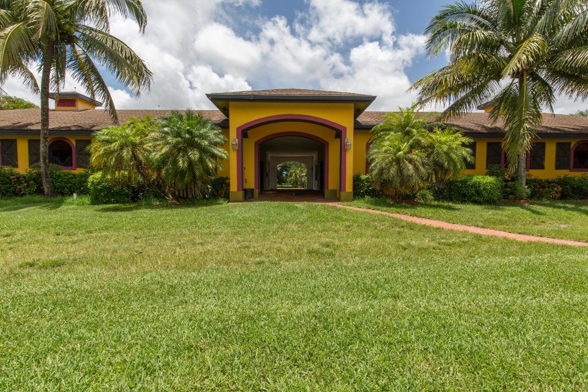 Extraordinary 10+ acre farm, designed to meet all your equestrian needs. This property features a completely remodeled 4 bedroom, 3 bathroom owner's residence with a  pool, office, formal dining room and impact windows. The equestrian features include 3 separate barns, totaling 28 stalls, a 350x200 grass field,  a separate GGT footing arena and multiple apartments for staff housing. Lush landscaping surrounds the entire facility, creating a private tranquil setting for the serious equestrian.