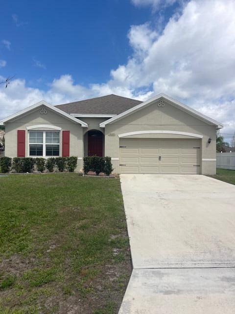 Lovely 4 bed 2 bath open floor plan home that shows like brand new in superb condition. Smart home features keyless code box door entry and alarm.  Located on a short street near Gatlin Blvd and quick access to I-95. Recent upgrades include new carpet in bedrooms, new dishwasher , Interior of home freshly painted & a/c just had major service on components. The yard is fenced on both neighbor sides and in back of home.
