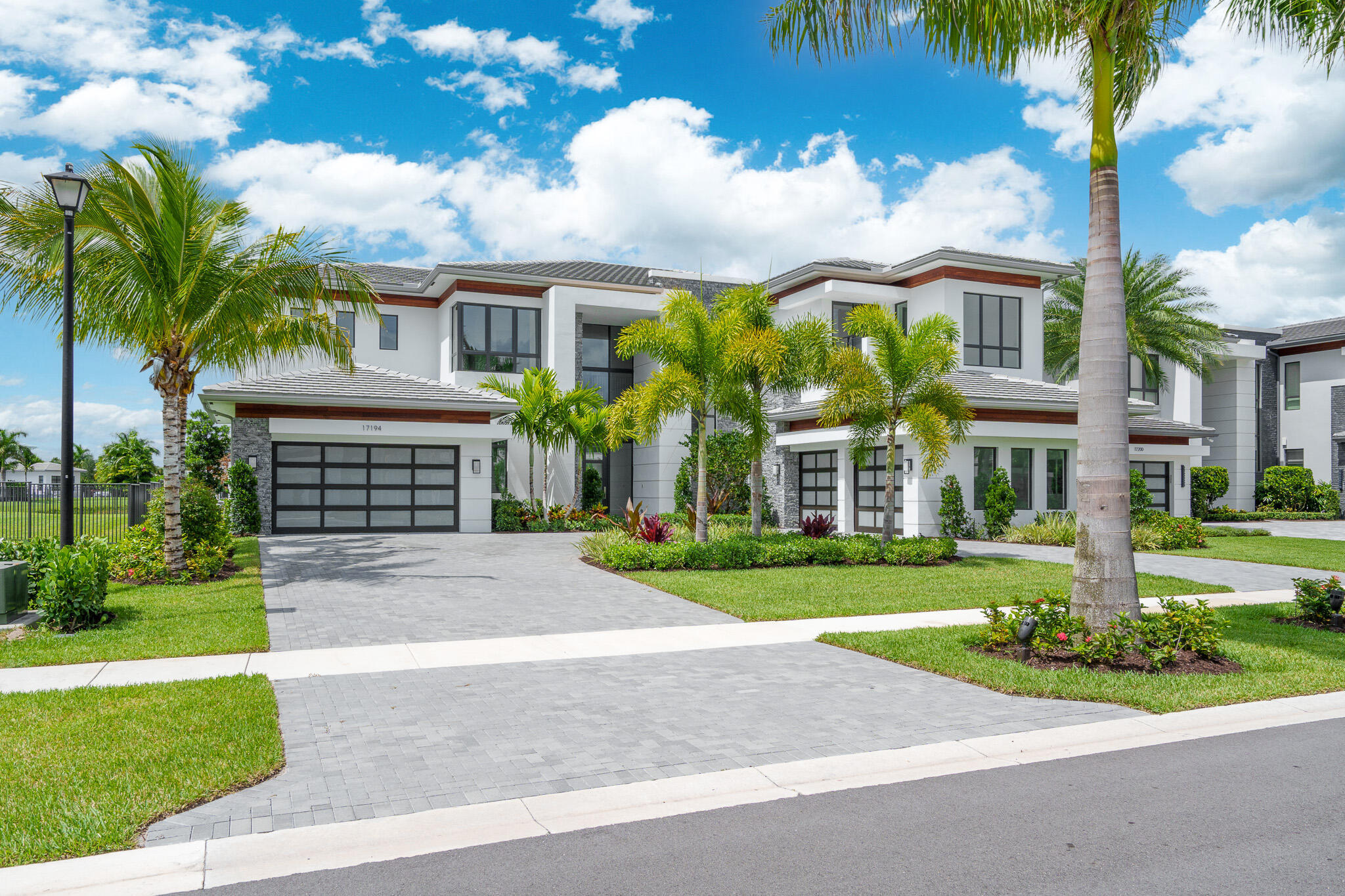 Experience elevated luxury living in this exceptional modern estate located in the prestigious Boca Bridges community. This spacious residence offers 6 bedrooms, 8 full bathrooms, 1 half bath, a private office, expansive club room, media room, and a luxurious primary suite featuring separate his-and-hers bathrooms and custom walk-in closets. Designed for both grand entertaining and everyday comfort, the home showcases sophisticated finishes, expansive living spaces, and a spectacular resort-style pool perfect for year-round outdoor living.  Residents of Boca Bridges enjoy access to an extraordinary five-star clubhouse featuring a state-of-the-art fitness center, resort-style pool with cabanas, full-service restaurant and café, tennis and pickleball courts, indoor sports court, splash park, playground, and a vibrant social lifestyle in one of Boca Raton's most sought-after luxury communities.