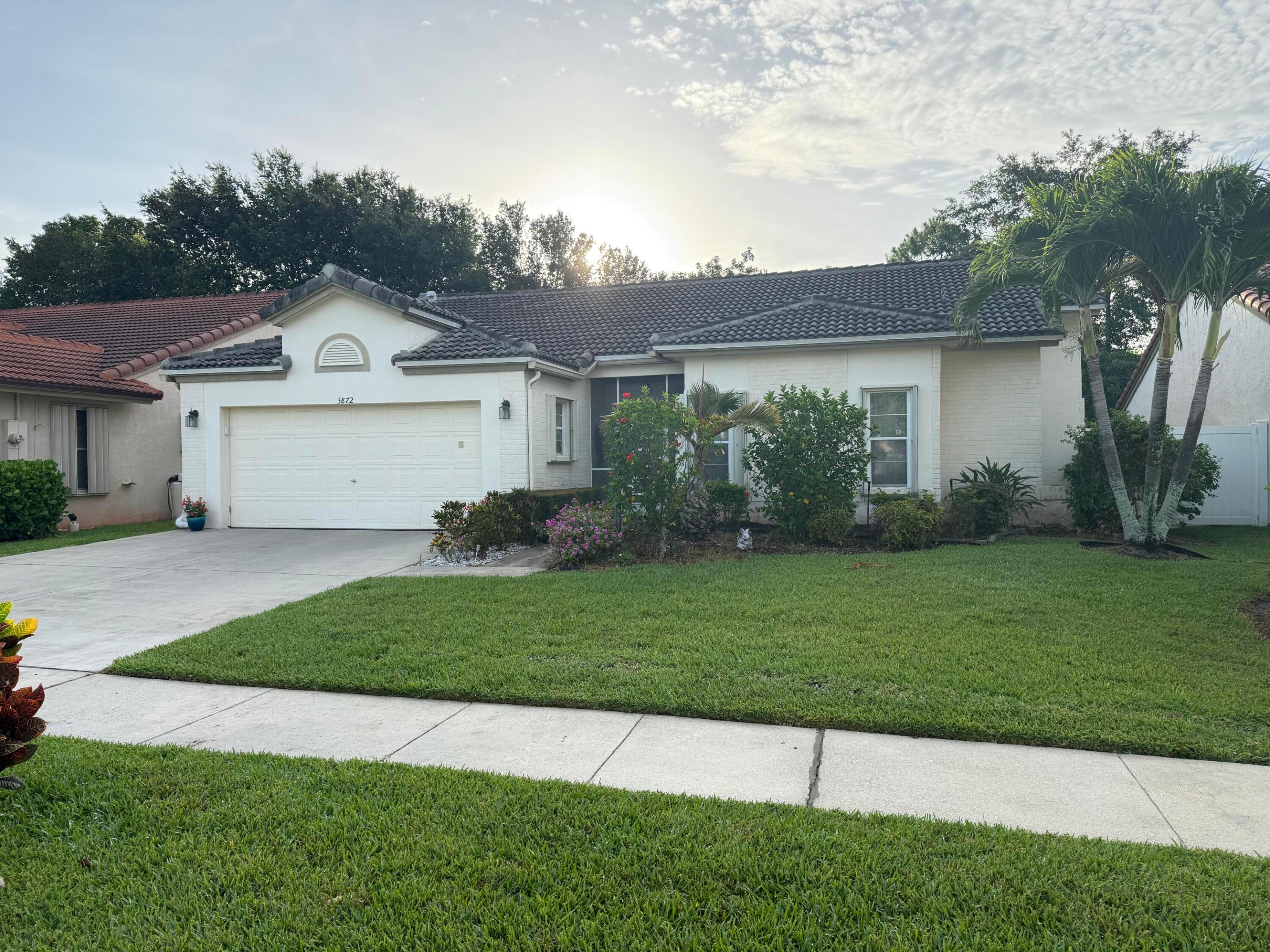Enjoy beautiful Florida sunsets from this charming 2-bedroom, 2-bath home with a desirable western exposure in the gated 55+ community of Summer Chase. Filled with warmth and natural light, this inviting residence offers comfortable living spaces, a newer roof for peace of mind, and a private fenced backyard—perfect for gardening, entertaining, or simply relaxing with your favorite beverage as the sun sets. Nestled within a beautifully maintained active adult community, residents enjoy a carefree lifestyle with amenities, social activities, and the security of gated access. Conveniently located near shopping, dining, medical facilities, and everything Palm Beach County has to offer, this delightful home is ready for its next owner to enjoy.  Come experience the perfect blend of comfort, privacy, and Florida living at its finest.