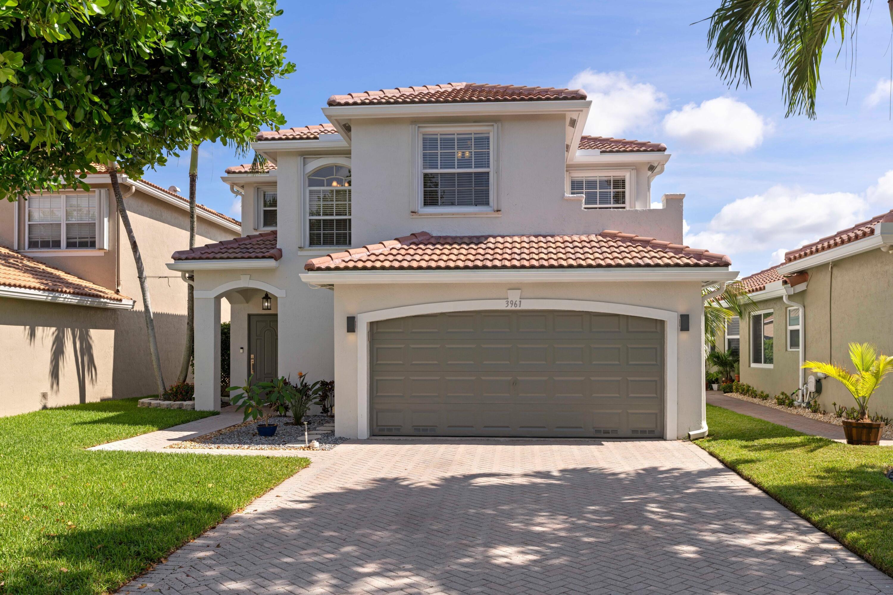 Stunning lakefront home in the desirable Crescent Creek community! This beautifully updated 3-bedroom, 2.5-bath residence features a new roof, impact windows and doors, newer A/C, fresh interior and exterior paint. Inside, enjoy a spacious updated kitchen, updated baths, and a large primary suite complete with an ensuite bath, dual sinks, and a walk-in closet. Step outside to your private paradise: a travertine patio with dual awnings for sun or shade, a sparkling saltwater pool, and peaceful lake views perfect for entertaining. The 2-car garage also features a large storage room. Low HOA fees and meticulously maintained surroundings make Crescent Creek a sought-after community. Conveniently located near parks, the Turnpike, The Promenade, shopping, dining, and entertainment.