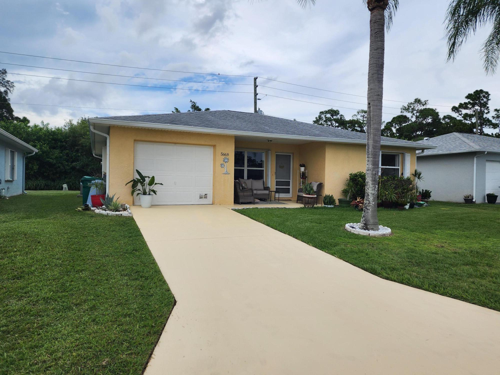 Private Preserve Views in Palm Grove! Enjoy the perfect blend of privacy, comfort, & an active lifestyle in this beautifully maintained 2-br, 2-bath concrete block home located in Palm Grove, a sought-after gated 55+ community. Nestled on a serene preserve lot, this home offers a rare level of privacy. The inviting cov'd front porch welcomes you into a bright open floor plan w/tile flooring throughout & plantation shutters. The spacious kitchen offers 42" white cabinetry & granite. The master suite features a relaxing bath w/separate shower, while the guest bath includes a soaking tub for added comfort. The light-filled FL room, enhanced w/impact windows, makes an ideal office, hobby room, or peaceful retreat. A/C (2025), Accordion shutters & painted expansive driveway w/ample parking. The HOA provides exceptional value, including cable, internet, lawn care, landscape trimming, water, and sewer.