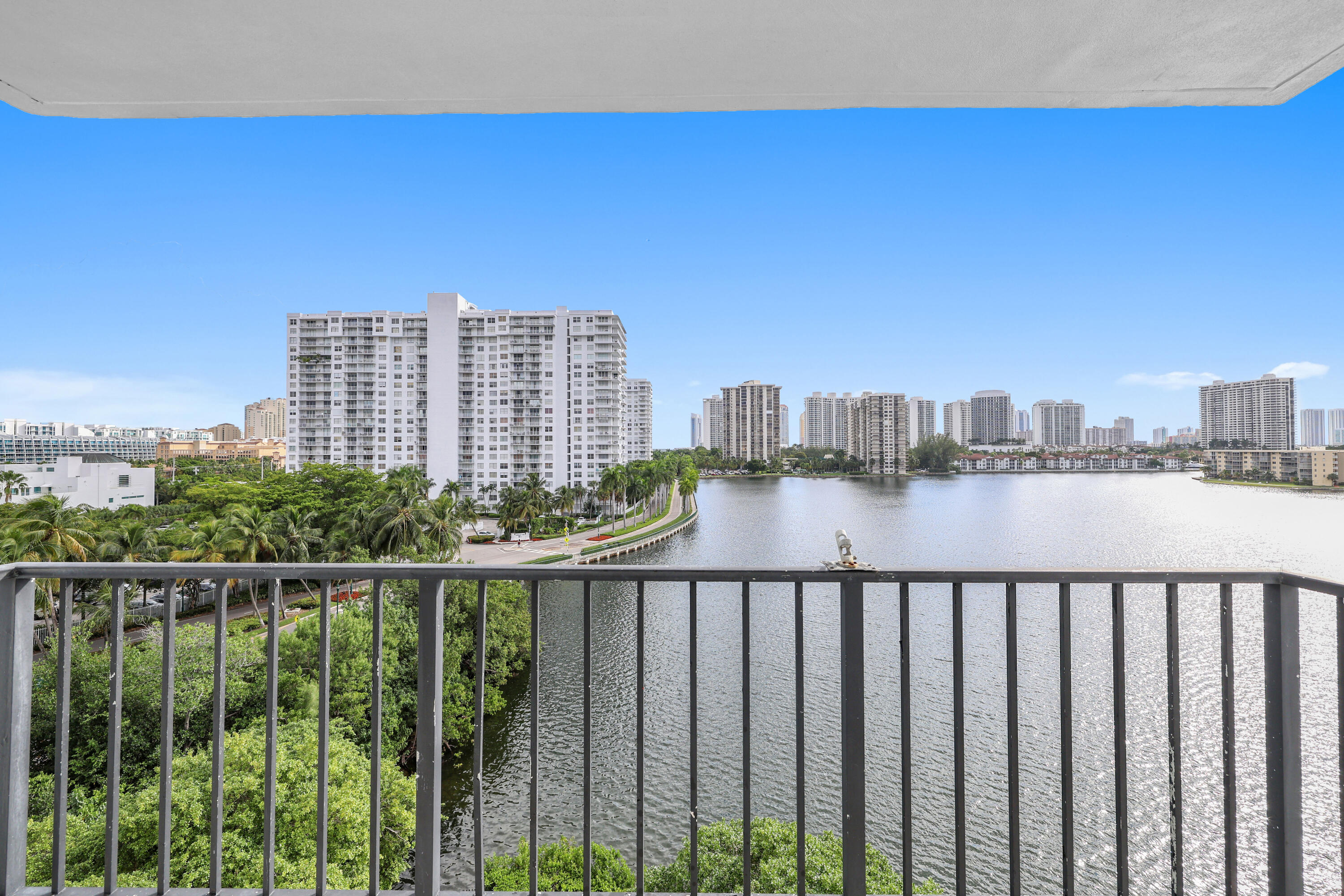 Enjoy breathtaking panoramic views from this fully upgraded 2-bed/2-bath corner unit at Commodore Plaza. Unobstructed bay and city views from the expansive balcony, cast radiant light into every room. Only minutes from the most beautiful beaches. This gem features a renovated kitchen with top-of-the-line stainless steel appliances and recessed lighting. Enjoy a wealth of amenities, including 24/7 security, tennis courts, basketball hoop, 2 pools, fitness center, marina access, bicycle storage, and a BBQ area. Covered parking space. Conveniently located near Aventura Mall, shops, restaurants, and the vibrant entertainment that Aventura offers. This residence invites you to experience resort-style living with awe-inspiring sunrises and urban walkability. Your waterfront oasis awaits.