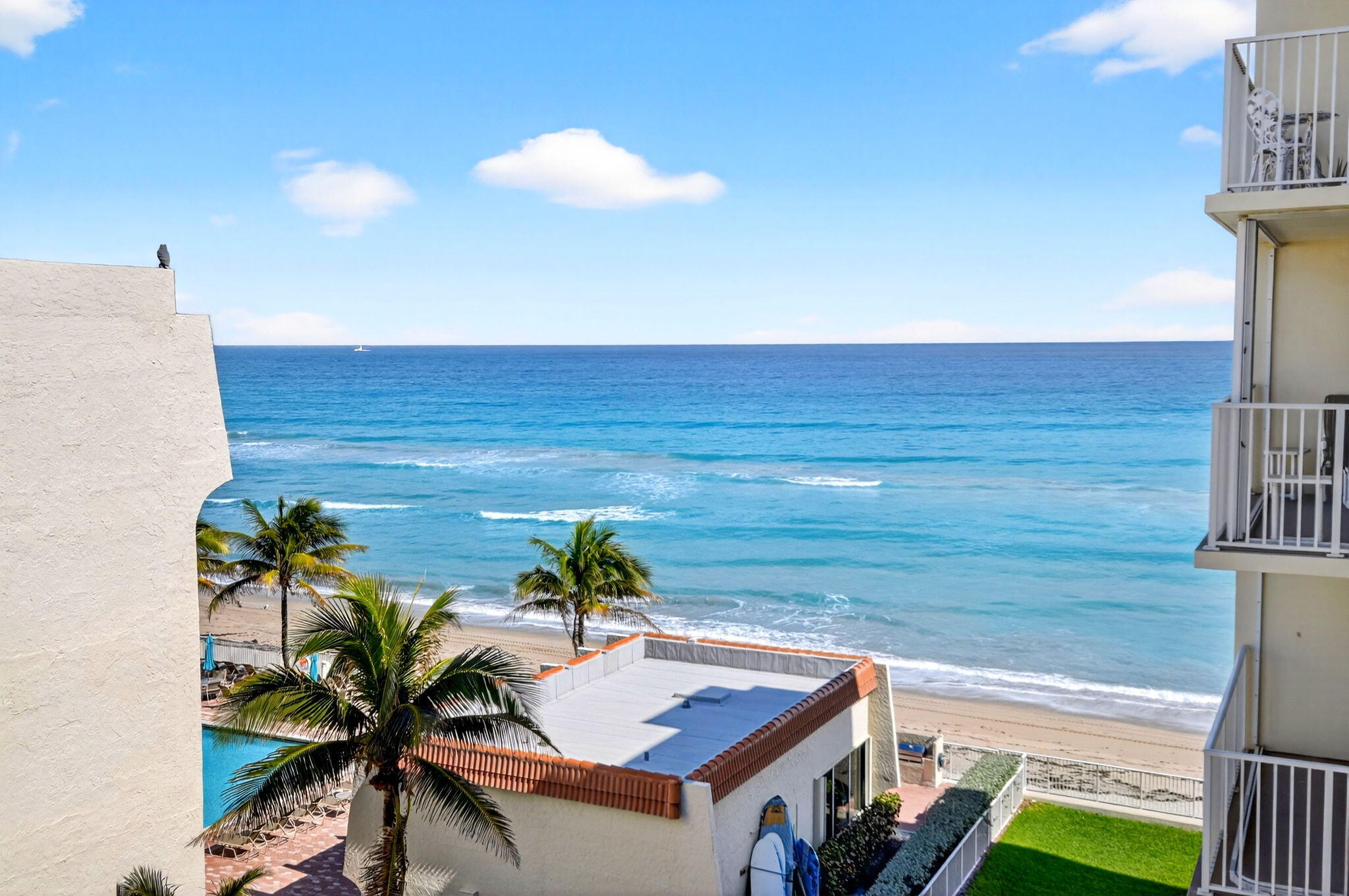 Wake up to ocean views in this beautifully maintained 2 bed, 2 bath condo on East A1A. An open kitchen flows seamlessly into the living area, perfect for entertaining or relaxed coastal living. Step onto the open balcony to enjoy sea breezes and sunrise skies. Located in a sought after oceanfront community with private beach access. AC replaced in 2022 for peace of mind. Bright, airy interiors and flexible space make this an ideal full time residence, vacation retreat, or investment. Furniture is negotiable, allowing for a smooth move in experience. Enjoy coastal convenience near dining, shopping, and scenic drives, with secure building features, assigned parking, and an easy lock and leave lifestyle just steps from sand and surf. Perfect for those seeking style comfort and coastal living