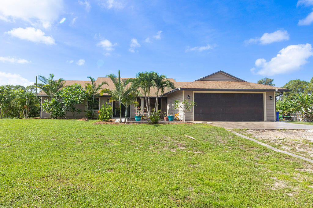 Private 4-bedroom, 2.5-bath home on 1.39 fully fenced acres with plenty of room for RVs, boats, trailers, pets, and more. Enjoy a spacious open floor plan, sparkling pool, and mature fruit trees including mango, peach, mulberry, bananas, and Barbados cherry. Conveniently located just minutes from shopping, dining, and top-rated schools. Experience the perfect blend of space, privacy, and convenience.