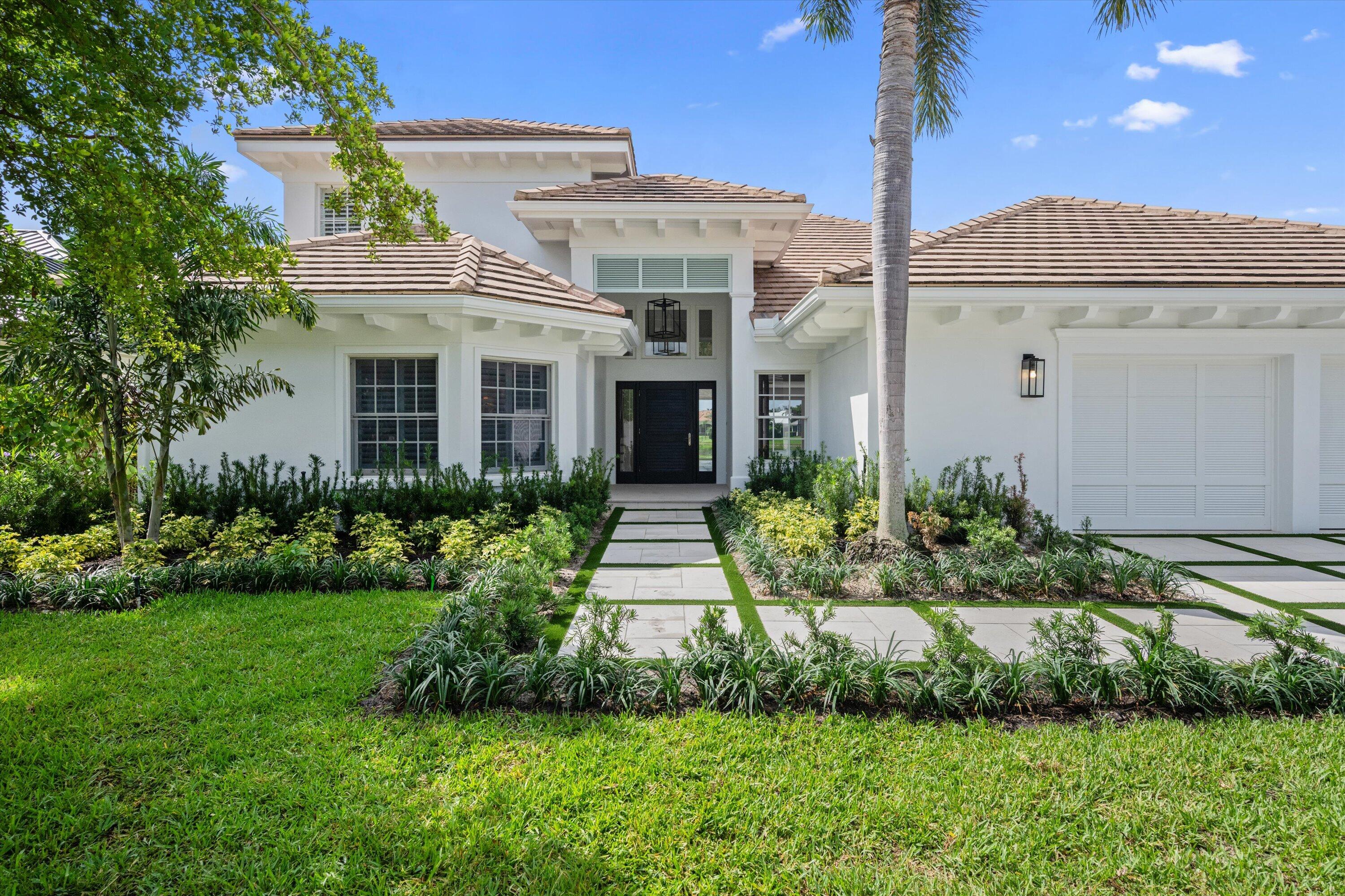 Welcome to this extensively renovated lakefront residence in The Loxahatchee Club, Jupiter's premier private golf community. At 204 Birkdale Lane, the water takes center stage. Set on a premium lakefront lot, the home captures sweeping, unobstructed views across a wide, tranquil lake, with natural light pouring through the entire rear of the home. Floor-to-ceiling impact glass sliders span the full rear elevation, drawing the eye straight to the water the moment you step through the front door. The great room, dining area, kitchen, and primary suite all open directly to the lake, creating a constant, serene backdrop throughout. The open-concept interior features coffered ceilings, a custom built-in entertainment wall, new flooring throughout, designer lighting, and a modern wood-and-metal staircase. The brand-new kitchen offers an oversized island with natural stone countertops, custom white shaker cabinetry, and seamless connectivity to the living areas, all framed by the lake. Additional upgrades include a renovated bathroom, custom trim and millwork, and a full interior and exterior repaint. The flexible two-story floor plan includes a first-floor primary suite with a spa-like ensuite, a guest suite, and a versatile den/office with a closet and adjoining full bath—well-suited as a fifth bedroom, private guest quarters, or workspace. Upstairs, two additional ensuite bedrooms provide ideal space for guests or family. Outdoor living is being reimagined with a new paver patio and a cohesive redesign of the exterior spaces. Several key enhancements have just been completed, including the brand-new pool, redesigned paver driveway and front walkway, custom closet systems, professionally refreshed landscaping, and a whole-home AV system (WiFi, TV, and multi-room audio). Additionally, the motorized louvered StruXure Pergola with Fenetex shade screens is nearing completion. A rare opportunity to secure a renovated lakefront home nearing completion within one of Jupiter's most sought-after private club communities. Each day offers a variety of activities and world-class amenities. Whether you're headed to the state-of-the-art fitness center, enjoying a spa treatment, or a refreshing swim, the Loxahatchee Club caters to your every need. The Signature Jack Nicklaus design offers a challenging and playable experience. After a day on the greens or the courts, explore the diverse dining options available within the community, from casual bites to gourmet culinary experiences, all just a short golf cart ride away. At the Loxahatchee Club, you're not just buying a home; you're embracing a lifestyle of unparalleled luxury and community. Explore the possibilities and envision making this your sanctuary, where every day feels like a vacation.