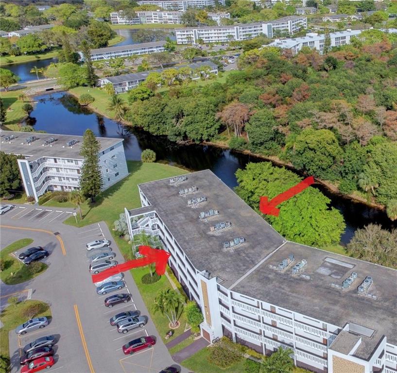 WATERFRONT - This bright, sun filled condo has a huge balcony that offers the BEST VIEW in the community. Enjoy the serenity of your new home as you watch local birds and creatures enjoying the nature preserve across the canal.  Ceramic tile throughout, the kitchen and full bath were recently remodeled. Located only 3.3 miles from the ocean, this 55+ gated community offers a 1600 seat theatre, art classes, movies, dancing, a full library, fitness facility and competitive billiards, to name a few of the indoor activities. Outdoors, you'll find 16 heated swimming pools, BBQ area, tennis courts, shuffle board, volleyball, bocce, petanque and pickle ball. In-house bus transportation available for shopping and medical visits and so much more. No leasing in this building