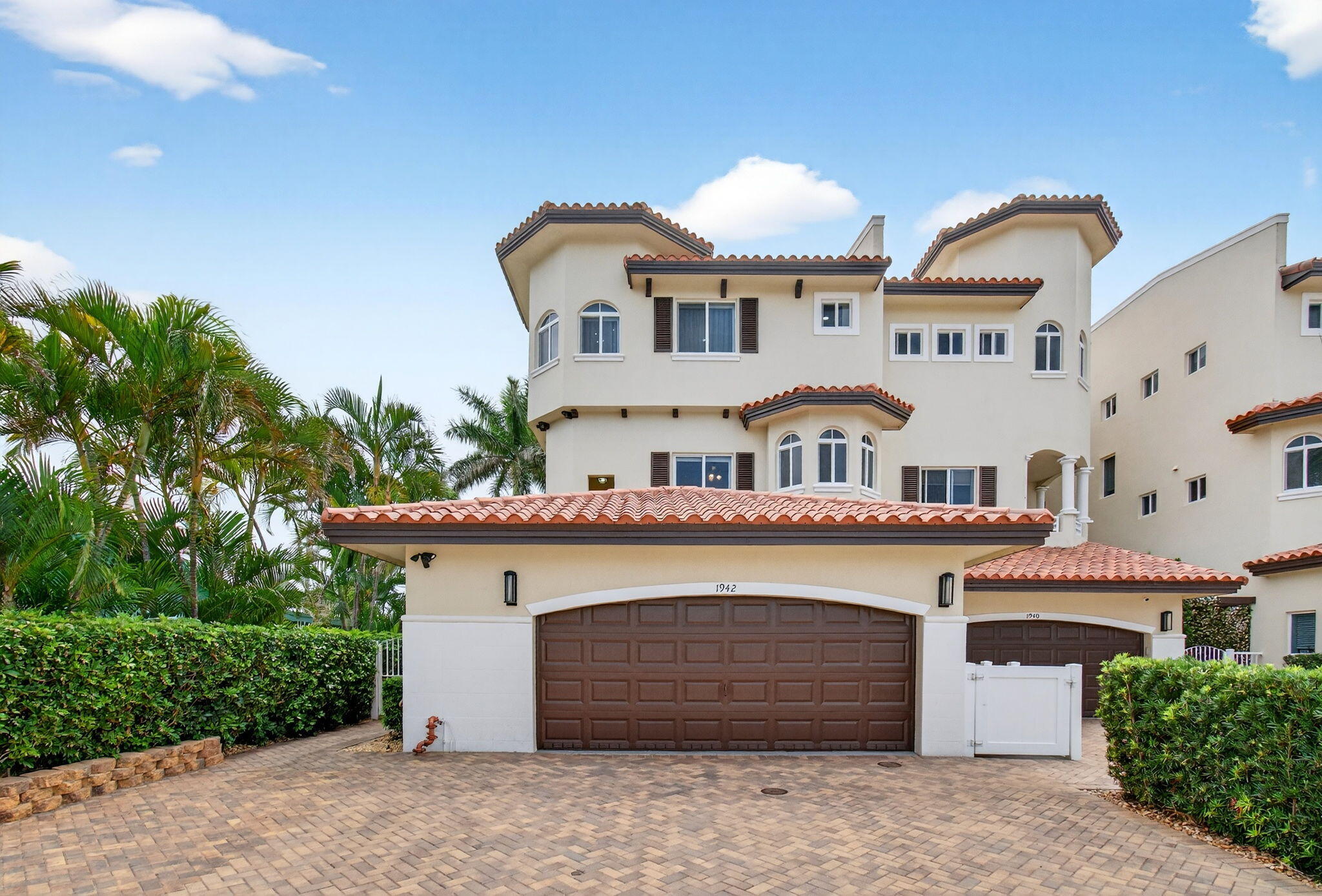 Don't miss this exceptional three-story townhome, masterfully remodeled with luxurious finishes and offered fully furnished for a truly turnkey experience. Just two blocks from award-winning Deerfield Beach, this residence embodies the ultimate coastal lifestyle — enjoy effortless day-to-night strolls along the shoreline, with vibrant dining, boutique shopping, and entertainment just moments away. Impeccably maintained, this home reflects true pride of ownership at every turn. Inside, you'll find impact glass throughout, stunning wood-look tile flooring, and designer lighting that creates a sophisticated, cohesive aesthetic. The thoughtfully curated kitchen opens seamlessly to the main living area, perfect for both refined entertaining and relaxed everyday living.  The second level features two spacious ensuite bedrooms, while the entire third floor is dedicated to a private primary retreat — complete with a loft-style sitting area and an expansive balcony offering wide-open, tranquil views. Ample, well-designed storage enhances both form and function. Additional features include a cabana bath, a lushly landscaped private backyard oasis, an elevator shaft for future installation, and a spacious two-car garage.   A rare opportunity to own a meticulously designed coastal residence where luxury, comfort, and location converge.