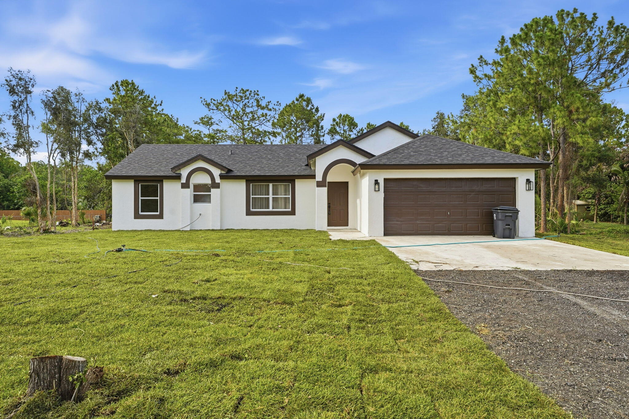 Come find your own piece of paradise with this beautifully renovated acreage home. This home features new porcelain tile floors, new kitchen, new bathrooms, new hot water heater, new electric panel, new HVAC system, new appliances, new water filtration system, and much more! The roof is only 2 years old. Come see the house today, you will not be disappointed!