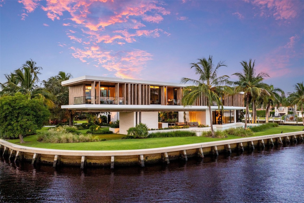 516 Mola. FTLs most unique, gated Peninsula Estate designed by renowned architect Max Strang & built by Bomar Builders, situated on 0.86 acres. Find panoramic views, a combined 640' of WF, a jaw-dropping floating Cantilever design & even a pickleball court! Notice a harmonious fusion of modern aesthetics and organic elements paired w/interior design by DKOR, crafted to complement the natural surroundings. Floor-to-ceiling windows & skylights grant natural light & Chef's Kitchen w/ hidden prep pantry w/ formal dining are perfect for entertaining. Be wowed by the Primary Suite's balcony w/New River views, gym, sitting room/office, expansive closet & spa-like bath. Home features include a full Apartment suite, movie theater, wet bar, European white oak wood floors & Savant/Lutron home system.