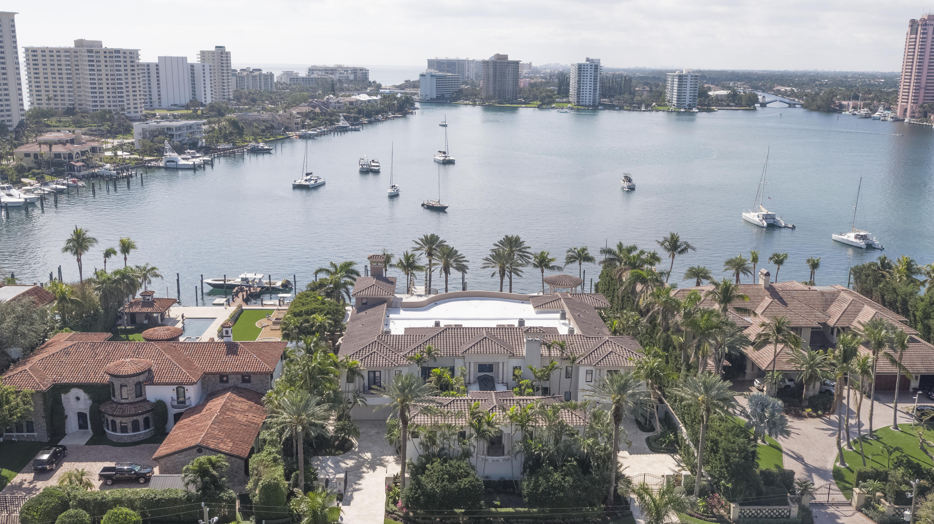 One of Lake Boca Raton’s best viewpoints is reserved for this imposing gated compound on 150± feet of shoreline, looking all the way down the water and surrounding coastline to the historic Boca Raton Resort & Club.  Unobtrusively placed to the side, the rare cut-in yacht slip is large enough for a 120±-foot vessel and is close to the inlet.  Additional dockage can berth another 75±-foot yacht.  Designed for large-scale gatherings, the sensational outdoor entertainment space centers on the 63±-foot infinity pool and grand loggia with a summer kitchen/bar, cabana bath, and boat equipment storage.  Exotic Medjool date palms are signature elements of the lush tropical landscaping. DISCLAIMER: The written and verbal information provided including but not limited to prices, measurements, square footages, lot sizes, calculations and statistics have been obtained and conveyed from third parties such as the applicable Multiple Listing Service, public records as well as other sources. All information including that produced by the Sellers or Listing Company are subject to errors, omissions or changes without notice and should be independently verified by any prospect for the purchase of a Property.  The Sellers and Listing Company expressly disclaim any warranty or representation regarding all information.  Prospective purchasers' use of this or any written and verbal information is acknowledgement of this disclaimer and that Prospects shall perform their own due diligence.  Prospective purchasers shall not rely on any written or verbal information provided when entering a contract for sale and purchase.  Some affiliations may not be applicable to certain geographic areas. If your property is currently listed, please do not consider this a solicitation. In the event a Buyer defaults, no commission will be paid to either Broker on the Deposits retained by the Seller.  "No Commissions Paid until Title Passes."  Copyright 2018 Listing Company. All Rights Reserved.