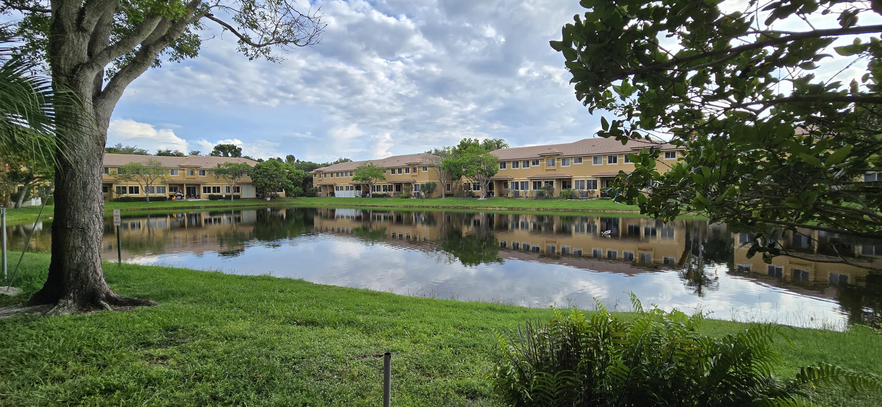 Amazing value for the square footage! Beautiful corner lakefront townhome built in 2007 featuring 3 bedrooms, 2.5 baths, 1-car garage & oversized double driveway. Wide lake views can be enjoyed from the family room, kitchen & primary bedroom. Desirable corner location with extra windows brings in abundant natural light throughout the home. Upgraded kitchen with granite countertops opens to spacious living & dining areas highlighted by archways and soaring volume ceilings, creating an open layout ideal for entertaining. Freshly painted interior with tile flooring in living areas & plank flooring in bedrooms. Large primary suite includes walk-in closet, Roman tub, separate shower & dual vanities. Full-size washer & dryer upstairs. Gated community with pool. Pet friendly