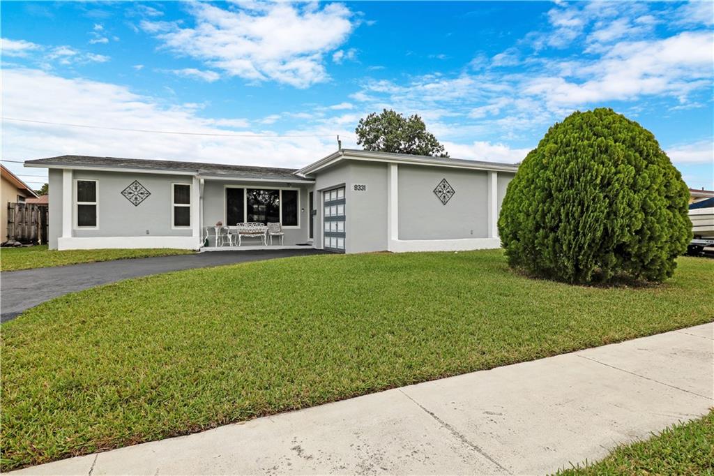 3/2 single family home with den, garage, and in-ground pool.  Split floorplan home offers hurricane impact windows & sliding doors, screened in patio, and newly painted exterior.  Stainless steel appliances in kitchen, tile floors & vinyl plank flooring throughout, updated bathrooms, walk in closet in master bedroom, newer a/c, & oversized garage allows for great storage.  Home is move in ready and can accommodate a large family.  Minutes from shopping, schools, and centrally located in Broward County.  Easy to show with 24- hour notice.