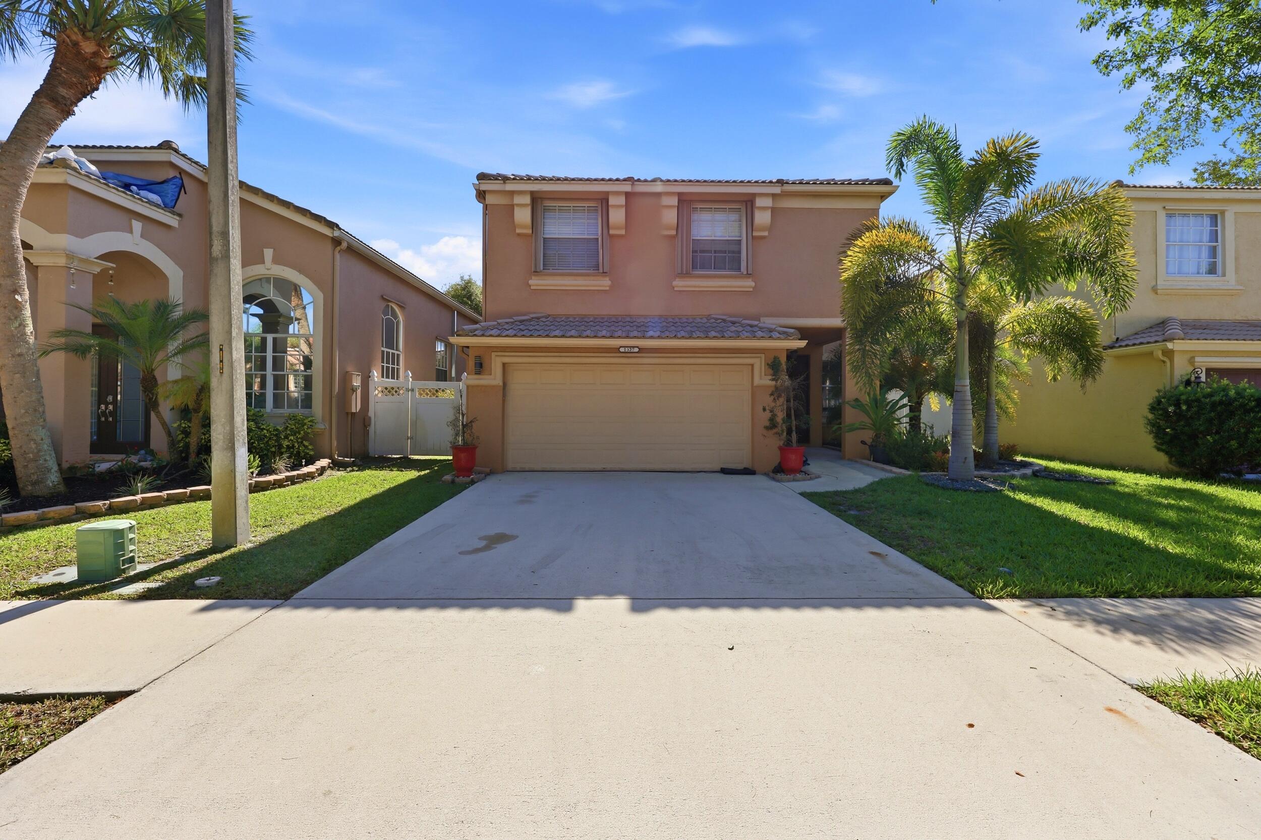 Welcome to this spacious five-bedroom, two-and-a-half-bath residence in Madison Green 1 Pars A, H and K, located in Royal Palm Beach, Florida. This two-story single-family home offers 2,693 square feet of finished living space, providing ample room for various living arrangements and needs. The property includes a two-car garage for convenient vehicle storage and parking. The thoughtful layout across two levels allows for excellent separation of living spaces and functional room organization. Whether you're seeking expanded square footage, multiple bedrooms for guests or home offices, or simply a well-proportioned residence, this home delivers practical appeal and livable space.