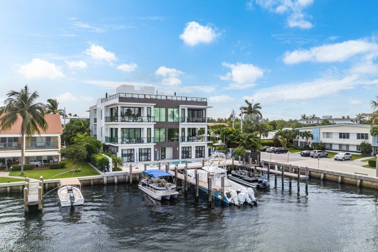This exceptional waterfront property at 344 Venetian Drive in Delray Beach offers a rare opportunity to own a luxurious Intracoastal condo in a boutique building of only four residences. This second-floor residence is situated in the heart of vibrant Delray Beach and is just steps away from Atlantic Avenue and the stunning beaches of South Florida. The condo features  it's own private 45' dock, a private rooftop lounge with a summer kitchen and spacious seating areas to enjoy cool outdoor entertaining.and is a perfect setting for hosting guests while enjoying the stunning views of the waterway. As you enter this charming 3 bedroom 3.1 bath condo with 3,369 TSF, you will be greeted by a beautifully appointed kitchen state of the art appliances, ample storage space and beautifully finished tile and wood floors throughout, which add to the luxurious feel of the property. The bright and airy great room is flooded with natural light, thanks to the floor-to-ceiling glass doors that lead out to a balcony, offering spectacular views of the Intracoastal waterway. The oversized owner's suite features a walk-in closet and overlooks the Intracoastal, providing a peaceful sanctuary to unwind after a busy day. The two additional guest suites are tastefully decorated and offer plenty of space for visitors. Residents of this stunning residence also have access to a waterside swimming pool and private cabana with a fridge, providing the perfect spot to relax and soak up the South Florida sun. The property also includes two garage spaces and additional storage. Along with the luxurious features of this property, the location, in one of the most sought-after areas of South Florida, offers a lifestyle second to none that includes world-class dining, shopping, and entertainment.