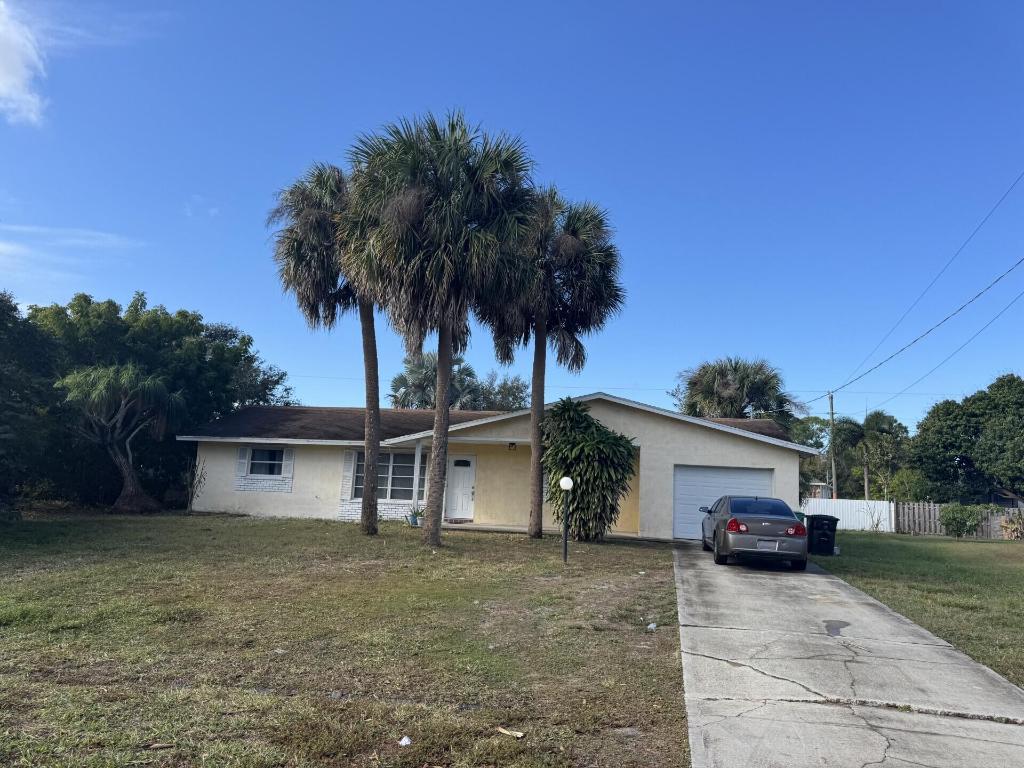 all measure approx. Beautiful 3/2/1 Remodeled house with laminate floors, completely renovated bathrooms and kitchen. The house has laminate flooring throughout. A spacious and private yard, ideal for children to play, or if you, as the homeowner, want to plant something, there is space for it.