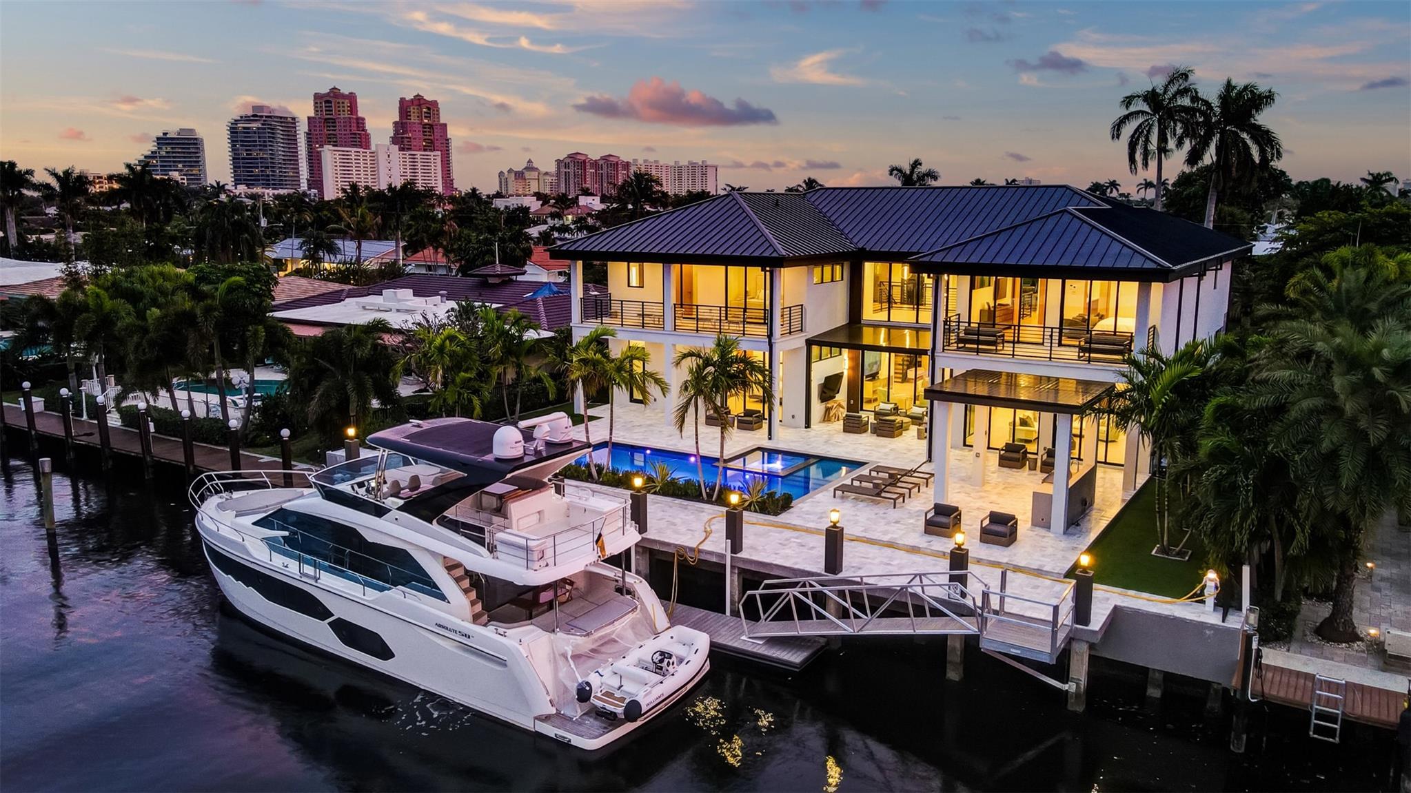 An extraordinary contemporary (NOW OFFERED TURNKEY) 100ft deepwater residence exceeds expectations! Extensive custom upgrades must be seen to be appreciated & ultimate yachtsman's amenities set this home apart! Almost 8,400sf total! 1st level: expansive, open concept entertaining & living areas flow outdoors, Chef's kitchen, formal dining area, one of two primary suites-all water/pool facing, guest bath, elevator, boat storage room, laundry room, pool access cabana. 2nd level presents beautifully: 3 spacious secondary bedroom suites, all custom baths & closet systems, glass enclosed home office/gym. Ultra-luxurious primary suite offers separate spa baths & dressing rooms, private balcony. Multiple balconies, covered terraces, Summer kitchen gazebo & floating dock create a resort ambiance. Custom Upgrades: Architect: Gerald Belgrave Designs, LLC * 4 AC's* 80 ft overall floating dock - ramp to 60 ft dock for boating safety & convenience (AccuDock)* Additional covered terrace by the pool* All TVS including two 85" Art TVs and all-weather outside TV* Approximate low tide depth 7 ft* Astroturf in the back and sides of the house* Automatic shades throughout* Custom closets in all secondary baths* Custom storage systems in garage* Custom tile backsplashes in both laundry/utility rooms* Dock Service: 3 x 50 amp plus 3 x 30 amp service* Electronic gates with openers* Extended & WiFi throughout the interior and exterior of the concrete constructed residence - perfect for home office* Extensive all new marble pool deck & surrounding areas* Generator* Lutron home technology* Marble driveway and pathway from the front gate* Quartzite countertops & breakfast area in Chef's Kitchen* Upgraded all perimeter kitchen cabinets & extended cabinetry to ceiling height* Walled & gated for privacy & security* Whole-house water filtration system*Freezer*Gas Stove Top*Microwave*Miele Appliances*Propane 1,000 gallon tank *Refrigerator *Two Dishwashers*Two Rheem tankless water heaters*Wine Storage