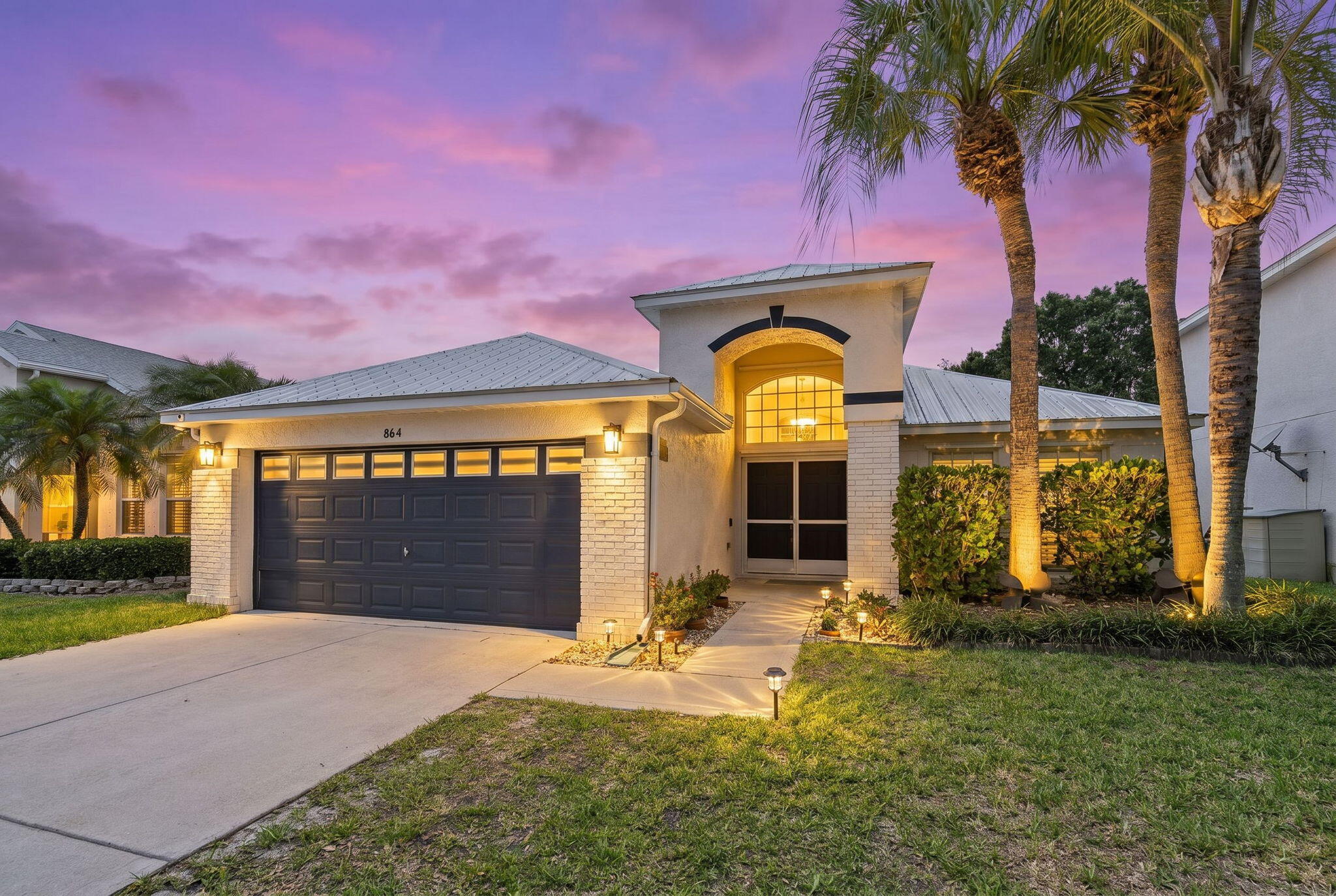 Located in the desirable Windemere community, this 3-bedroom, 2-bath CBS home offers a functional split floor plan, comfortable living spaces, and a location that places you close to everything the Treasure Coast has to offer. Built in 1999 with a 2019 roof, the home features fresh interior paint, an updated patio area, hurricane shutters, and a 2-car garage. The breaker box has also been outfitted for a 50-amp Tesla charger, and a plug-in generator is available separately for purchase. The layout provides an easy flow for everyday living, with spacious main living areas and plenty of natural light throughout. The home has been well maintained and is move-in ready, while still offering the opportunity for a buyer to make cosmetic updates over time to match their personal style.  HOA amenities include common areas, playground, and jogging and bike paths. Conveniently located near Port St. Lucie, Jensen Beach, and Stuart, the home is approximately 10 minutes to downtown Stuart, 10 minutes to the beach, and close to major shopping, dining, and commuter routes.
