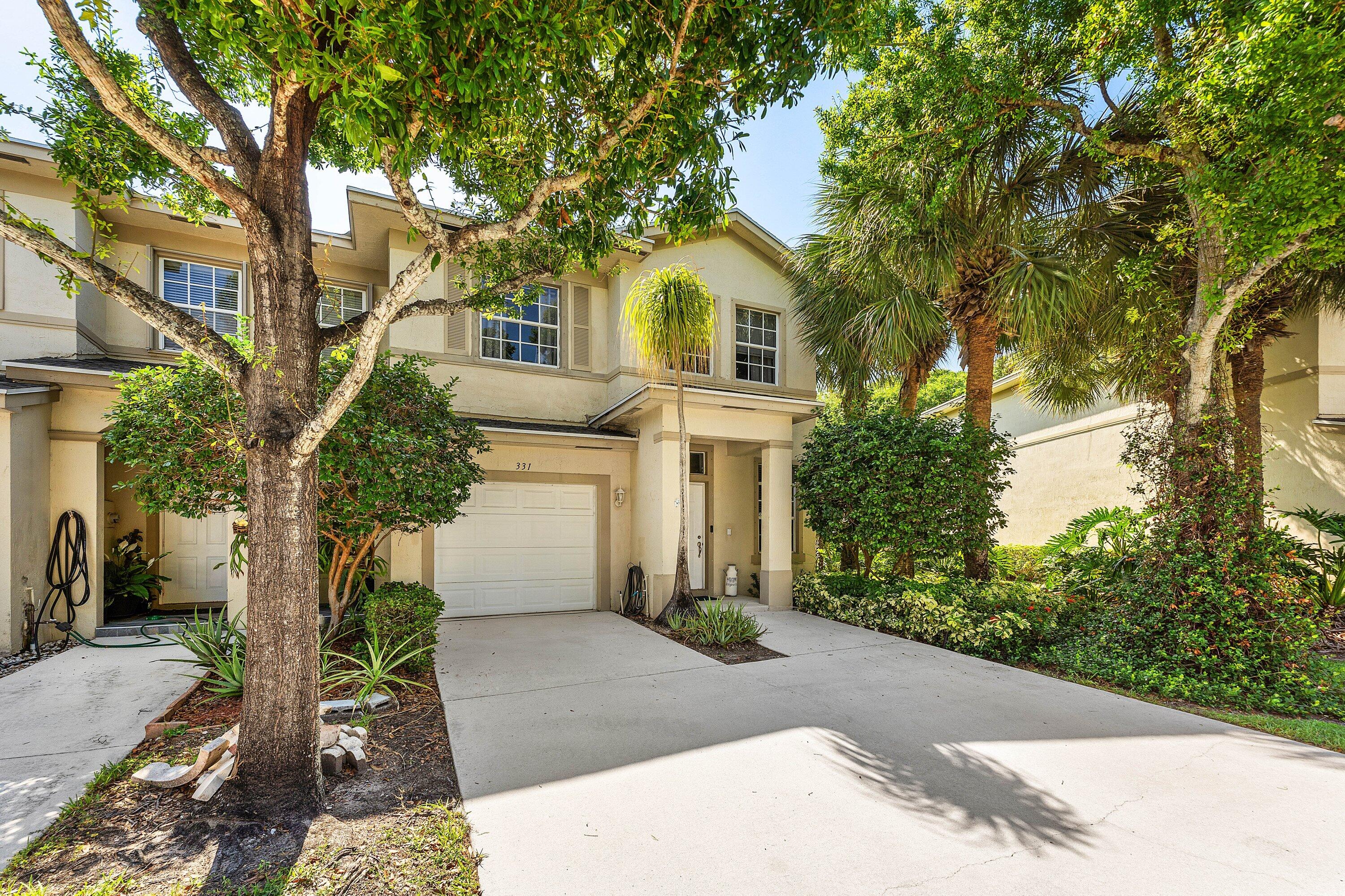 This spacious townhome is ready for you to make it home! Featuring a large living room, 1 car garage, open concept kitchen and dining/family room, and a screened in patio, you will fill right at home. The location is close to absolutely everything! Easy access to i95, Publix, Downtown Delray and West Palm, and the airport. This home is in a very quiet part of this quaint, tree lined, and guard gated neighborhood. The lanai and driveway have been freshly power washed. Come see this home today!