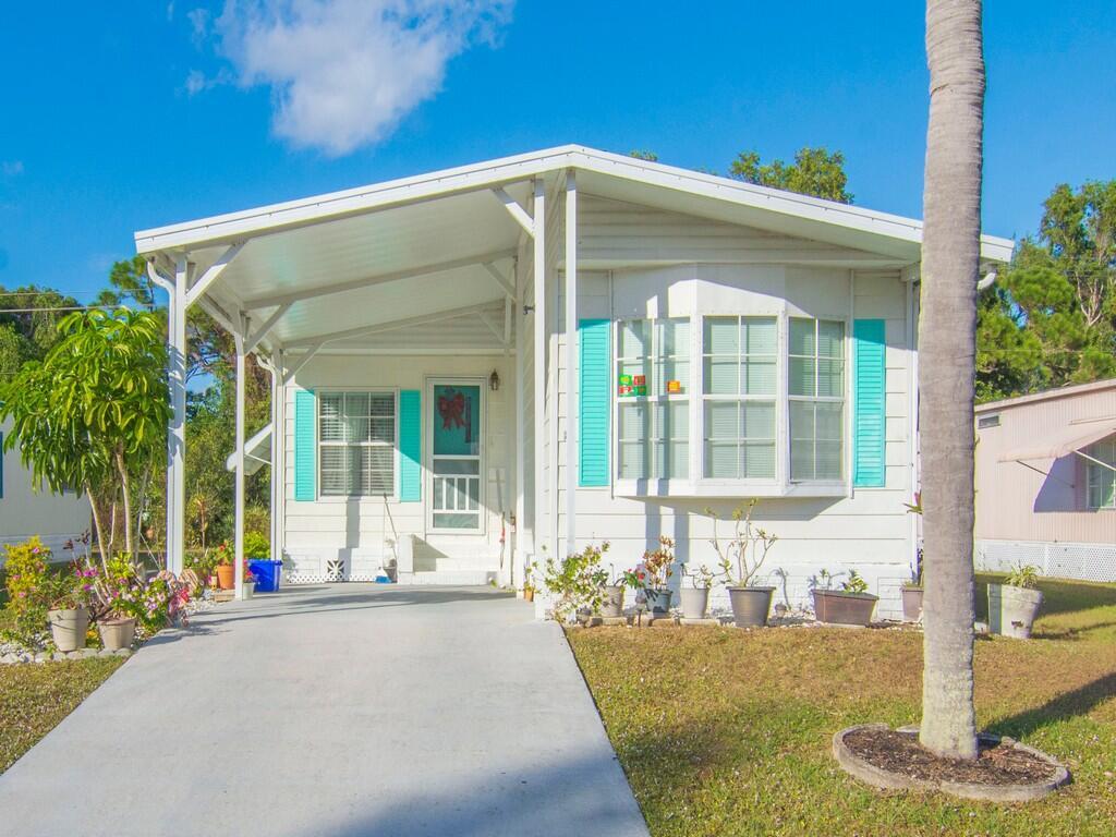 Discover comfort, style, and convenience in this manufactured home located in a quiet, desirable area of Port St. Lucie. This residence is perfect for both everyday living and entertaining. The spacious main living area features a seamless flow into the dining space and kitchen. The kitchen offers generous cabinetry, ample counter space, and a functional layout ideal for home chefs. The primary suite provides a peaceful retreat with a well appointed bathroom and excellent closet space.  The property offers great curb appeal, a dedicated laundry area and lots of storage.  A wonderful opportunity to own a charming, move in ready home in a sought after location.
