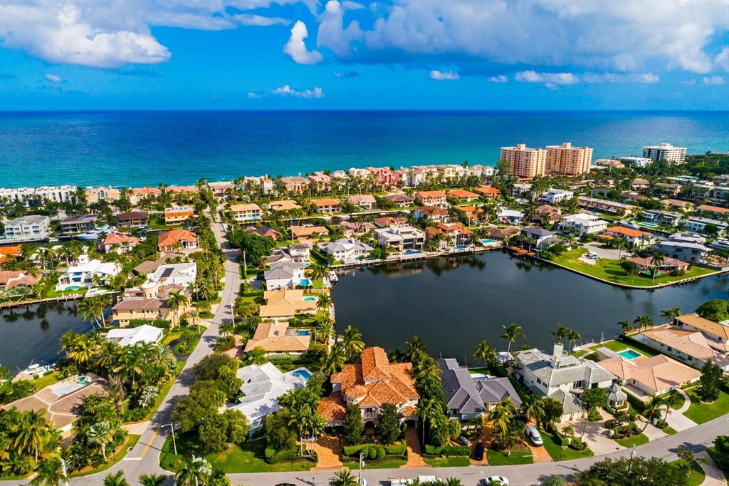 PRICED BELOW APPRAISED VALUE! Stunning Beachside Waterfront Property located on Yacht Basin with Panoramic Views. Easterly breezes set this Tuscan-Transitional style home apart from all the others. With Soaring ceilings, top of the line finishes, state of the art Movie Theater room with loft & wet bar, impact glass, full house generator, air conditioned garage, resort style amenities featuring a grand loggia with heated pool & spa, Summer kitchen, PRIVATE BEACH ACCESS, 70ft of waterfront and terrace views from almost every room. Featuring 5 BRs 5 & 2 1/2 baths, beautiful Jerusalem limestone throughout, Gourmet Chefs kitchen with Wolf, Meile, Gaggenau and Subzero appliances. Master BR features fireplace, custom sound system, morning bar and walk-in closets with his and hers bathroom, ... heated floors& Jacuzzi. Extra features include 2 laundry rooms, crestron system, and Elevator. Dock your 68' foot yacht behind this rare and gorgeous home located in Bel Lido.  Minutes to the inlet by boat.  No need to look any further as this is a boaters dream! Shown by appointment only to pre qualified buyers.
