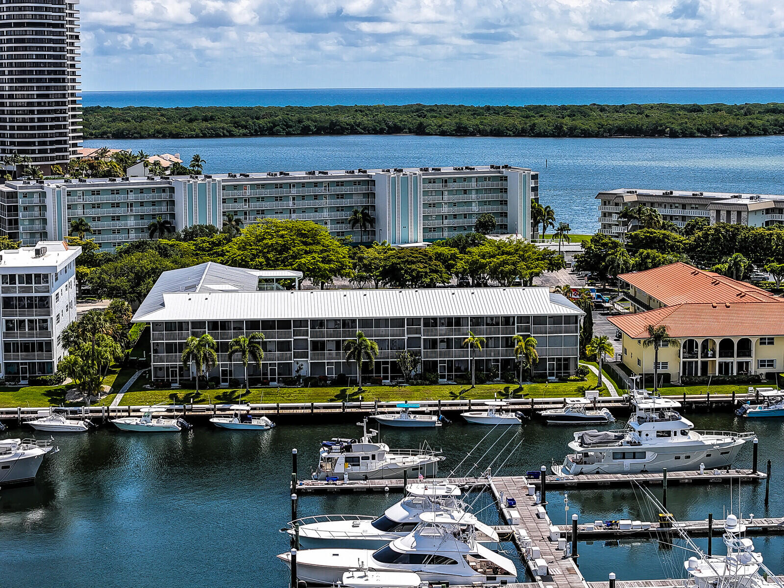 This hidden gem is NOT a 55+ community. Welcome to bright, open living just steps from the Intracoastal Waterway and North Palm Beach Marina. This move-in ready unit features a spacious layout, updated bath, and private screened balcony. All assessments have been paid in full. Reserves are plentiful. New metal roof. Enjoy a resort-style pool, clubhouse, and full dock access, with community boat slips leased upon availability. Walk to North Palm Beach Country Club, golf, dining, and more. Ideal for seasonal or full-time coastal living.