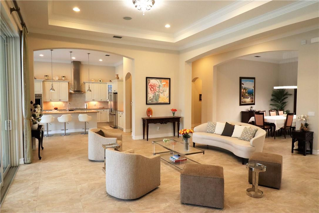 A pool mediterranean home in a beautiful, safe and very private gated community in Davie: Sterling Ranch. This is a luxurious home that features 5 bedrooms + office (one of the 5 bedrooms is currently set up as a den/media room), 3 full bathrooms and a half/guest toilette. There's the additional 12' x 13' office/study right at the entrance of the home, ideal for work at home/remote work. A circular driveway that leads to a 3 car garage and a separate 1 car garage for a total of 4, including 2 separate level 2 EV car chargers. There are multiple upgrades with exquisite finishes, too long to list here. The social areas were built with an open concept, ideal for entertaining. The kitchen has an oversize island, lots of storage and 42' cabinets.For more remarks, click on “Supplement” There are also a separate dry bar and wine tasting/service counter with built in dual zone wine cooler. The master bedroom with suite bathroom has lots of windows with beautiful views of the lake and pool. High ceilings throughout with unique designer lighting fixtures. All windows make a very bright house with views to lush gardens,  tropical landscape with many palm trees. The large covered courtyard perfectly integrates with a custom built heated roman style pool/spa that has a large pool/spa with an outdoor shower and a 12 x 12 Italian travertine marble deck overlooking the lake. The house is cooled by 2 quiet high efficiency AC units, has a monitored central security system anda Nutone central vacuum system. There's a built in surround sound system with 3 zones amplified by 3 separate Sonos amplifiers, with in ceiling Bose speakers (6 indoor and 2 outdoor). All windows and doors are impact resistant. Sterling Ranch has an ideal location near Griffin Rd., with easy access to Miami International and Fort Lauderdale Airports, the Florida Turnpike and I-95 or I-595 nearby. It is close to great restaurants, shopping, the Hard Rock Hotel and Casino, and world class beaches only 15 minutes away. Great schools and houses of worship nearby.