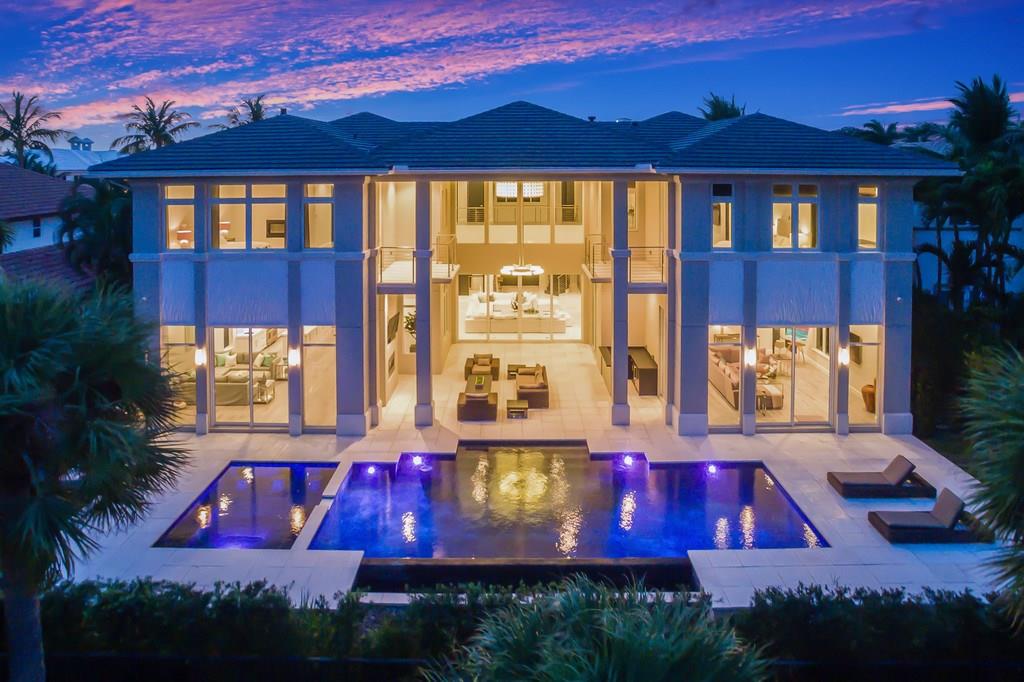Premier modern golf course estate in Royal Palm Yacht & Country Club.  This property offers a sweeping view over the 6th fairway & features contemporary design. This 5 bedroom, 6 full bath, 2 half bath residence features marble floors, volume ceilings, stunning chandeliers, a Chef's Kitchen, walk in 500+ bottle wine cellar, Club room with onyx bar & Home theatre.  An expansive outdoor lounge offers, pool, spa, fireplace & full home generator. Home comes fully furnished with smart technology package.
