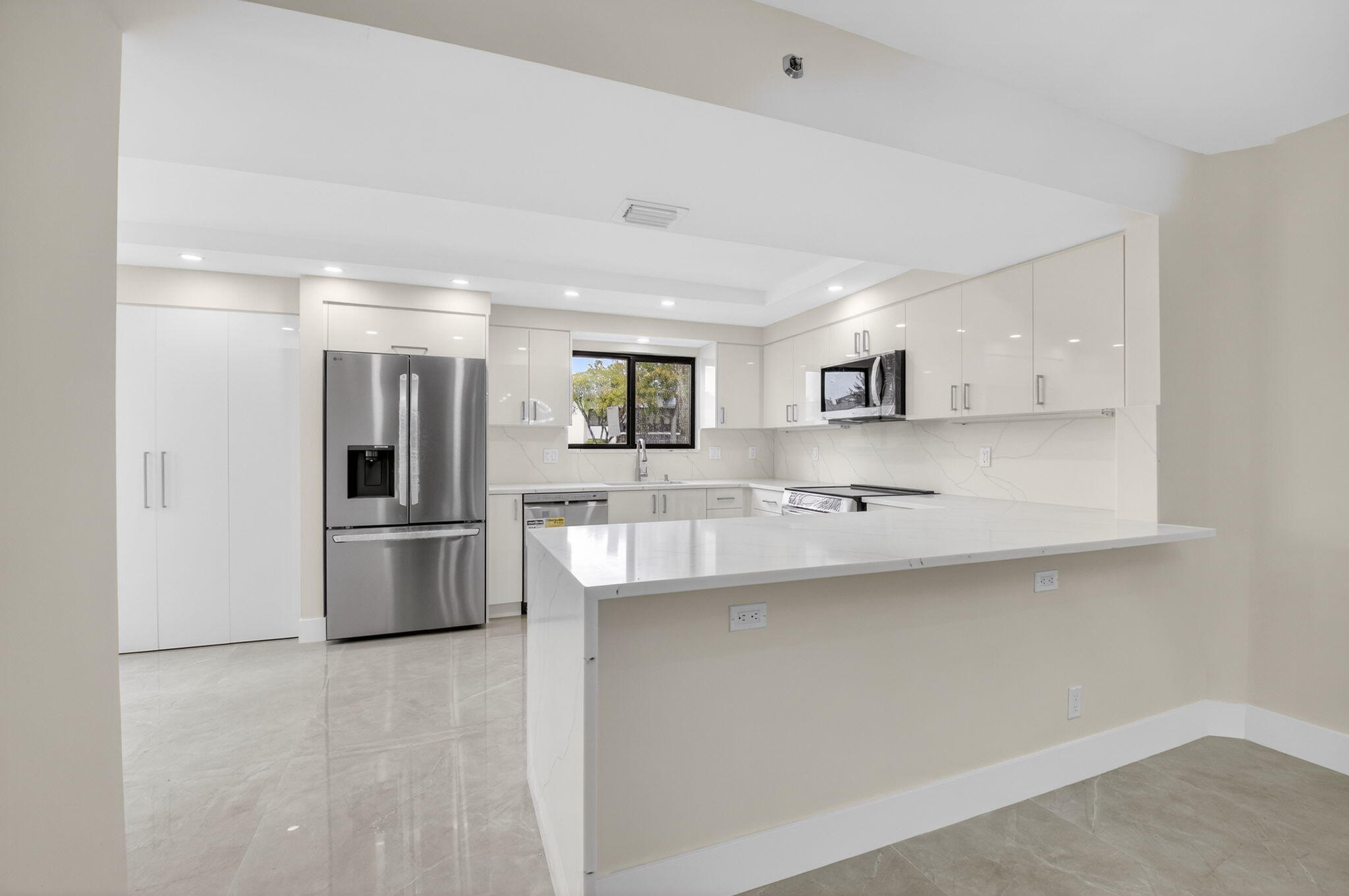 ONE OF THE MOST SOUGHT AFTER MODELS ON FIRST FLOOR OVERLOOKING GOLF COURSE AND 2 MINUTE WALK TO MAIN CLUB HOUSE. CONDO IS IN THE PROCESS OF BEING COMPLETELY UPGRADED AND REMODELED. ALL NEW KITCHEN, OPENED UP INTO LIVING AND DEN AREA. 2 BEDROOMS WITH 2 BATHS COMPLETELY REDONE. NEW LARGE PORCELAIN TILES  THRU OUT. IMPACT WINDOWS THROUGH OUT. all new stainless appliances, all new 
from floor to ceilings, a real must see!!! this condo is in one of the most sought after country clubs with two golf courses, tennis, pickleball, 8 pools, fitness center, spa, 3 restaurants,3 bars, card rooms, and much much more.