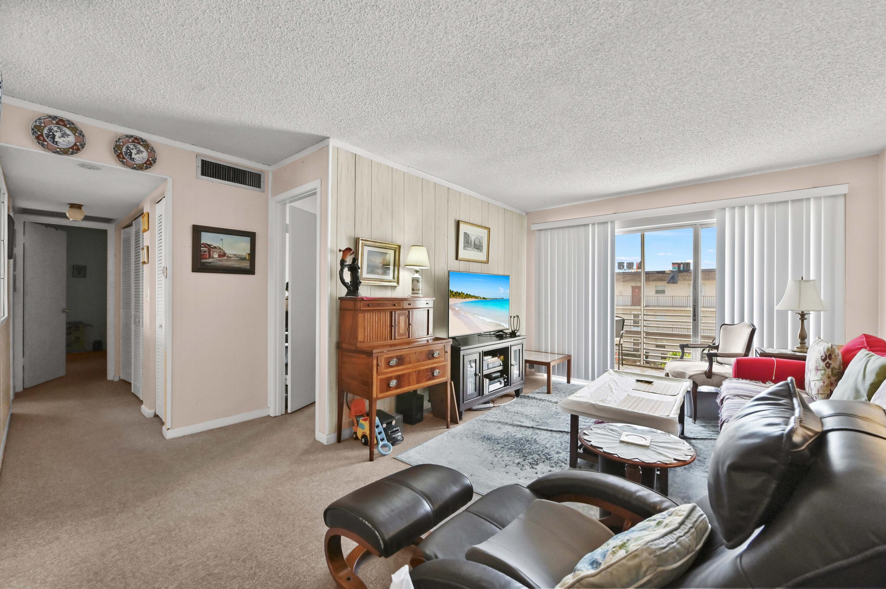 Welcome to LAKESIDE VILLAGE CONDOMINIUMS, a desirable 55+ community offering comfort and convenience in a peaceful setting. This well-maintained 3-story condo features approximately 900 sqft of living space with 2 bedrooms and 2 full bathrooms.  The unit offers a functional layout with carpeted flooring throughout, creating a warm and inviting atmosphere. The kitchen comes equipped with appliances and ample cabinetry for storage, providing both practicality and efficiency. Enjoy year-round comfort with a new HVAC system already in place. Relax and unwind on the closed/screened balcony, perfect for enjoying fresh air while staying protected from the elements.  Experience living in a welcoming 55+ community at LAKESIDE VILLAGE CONDOMINIUMS, ideal for full-time residence or seasonal retreat.