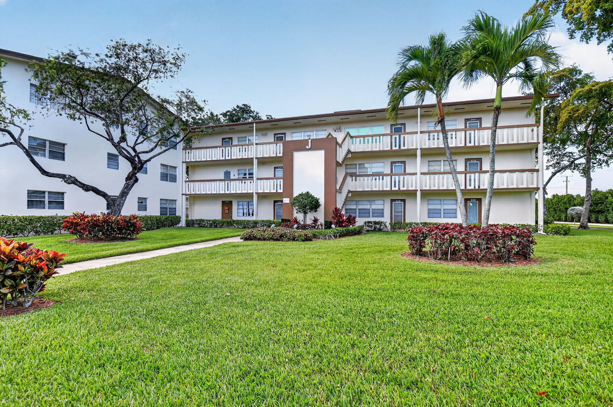 Move right into this updated 1 bed, 1.5 bath 3rd-floor condo in desirable Century Village! Features include updated bathrooms with new vanities and a beautifully renovated main shower, tile flooring throughout, enclosed patio space, and two new wall A/C units. Enjoy resort-style 55+ living with amenities including internet and WiFi, fitness center, live shows, movies, classes, bingo, card rooms, tennis, pickleball, community buses, trips, and more. Conveniently located near shopping, restaurants, and houses of worship. Come experience the lifestyle for yourself and tour the incredible clubhouse!