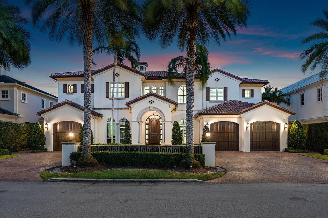 Enjoy this exceptional opportunity to live in Boca Raton's most prestigious community, Royal Palm Yacht & Country Club, where luxury meets waterfront perfection. This 5-bedroom SRD Signature Estate boasts contemporary design and impeccable custom finishes. As you enter through the solid mahogany door, imported marble flooring guides you to breathtaking waterway views. The first floor features a gourmet kitchen with top-of-the-line appliances, a bar-equipped clubroom, and a family room seamlessly connecting to the outdoors. Upstairs, the master suite awaits with its own morning bar, His & Her spa-like baths, boutique closets, and a balcony overlooking the spectacular grand canal. Four additional guest suites, a loft-style living room, and a spacious wrap-around balcony complete the second floor.

Outside, indulge in paradise with a heated pool, raised spa, covered patio, and a summer kitchen with BBQ. The summer room offers a gas fireplace and ceiling speakers, a perfect spot for all-day poolside relaxation.
Boaters will appreciate the 90' yacht-ready dock with a limestone deck, power, water, and a floating dock extension for kayaks. Safety and convenience are paramount, with hurricane-resistant construction and a Crestron smart home system remotely controlling various aspects of the property via phone or tablet.
