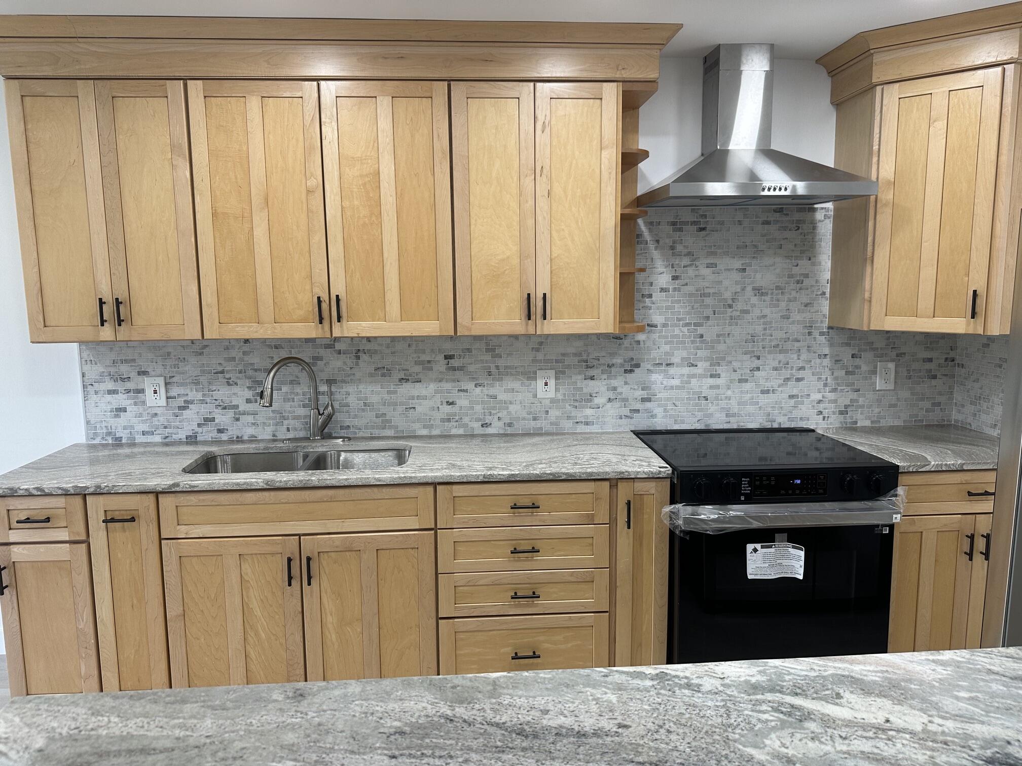 Completely renovated and move-in ready, this stunning villa offers modern upgrades and effortless Florida living! Featuring LED lighting throughout, beautiful luxury vinyl plank flooring, and a stylish kitchen with KraftMaid cabinetry and granite countertops carried throughout the home. Located in Golden Lakes Village, a gated, 55+ community, on desirable Lake Rebecca—one of only three streets in Phase B with a rare 10' wide patio and covered entrance—this home offers both charm and exclusivity. Enjoy your spacious 22x10 enclosed patio with an additional storage closet, perfect for relaxing or entertaining. Full-size washer and dryer included. Just a short stroll to the private satellite pool for Lake Rebecca residents, plus access to an amenity-rich community with a full-time social  director, tennis, pickleball, billiards, auditorium, café, and countless social activities. Maintenance includes Xfinity TV & internet, water, building insurance, and more—making for truly carefree living. Pet-friendly (1 dog up to 30 lbs allowed). Convenient courtesy bus service runs 5 days a week to grocery stores, shopping, and major retailers. Don't miss this beautifully upgraded home in a vibrant, active community!