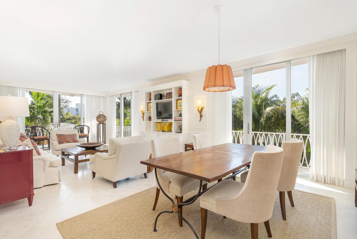 Located on the top floor of The Australian, this southwest-facing condominium offers 2,120± total square feet with two bedrooms, two bathrooms, and abundant natural light. A foyer with a custom built-in opens to the main living and dining area with floor-to-ceiling doors and windows that open to a large wraparound balcony.

The eat-in kitchen features Gaggenau appliances—including a microwave, oven, cooktop, and dishwasher—along with a Sub-Zero refrigerator and freezer, ample storage, a built-in banquette with table for casual dining, and a separate service entrance.

The primary suite includes two walk-in closets, a built-in desk, and a well-appointed bathroom with dual sinks, a soaking tub, and a walk-in shower. The guest bedroom offers its own walk-in closet and built-in desk, with a full bath across the hall. Both bedrooms enjoy direct access to the wraparound balcony.

Additional features include two parking spaces, and in-unit laundry.

The Australian is a boutique 12-unit building known for its privacy and in-town convenience ideally located just blocks from Worth Avenue, the beach, the Lake Trail, and Palm Beach's premier shopping and dining. The building offers a pool, full-time manager, doorman services, a guest bedroom for overflow guests, laundry room, as well as 2 storage rooms.