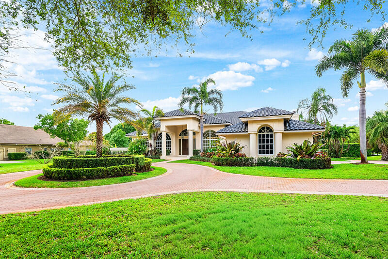 Located in the prestigious gated community of Cypress Head in Parkland, this elegant home sits on an oversized corner lot surrounded by estate-sized properties and custom homes. The residence features four spacious bedrooms, a private study, and three and a half bathrooms with a desirable split floor plan. The primary suite is privately positioned away from the additional bedrooms. Soaring ceilings and a dramatic floor-to-ceiling window fill the living area with natural light, opening to a spacious kitchen and bar ideal for entertaining. Hurricane impact doors and accordion shutters provide peace of mind. Step outside to a private pool and tranquil backyard, creating your own secluded sanctuary within one of Parkland's most sought-after communities.