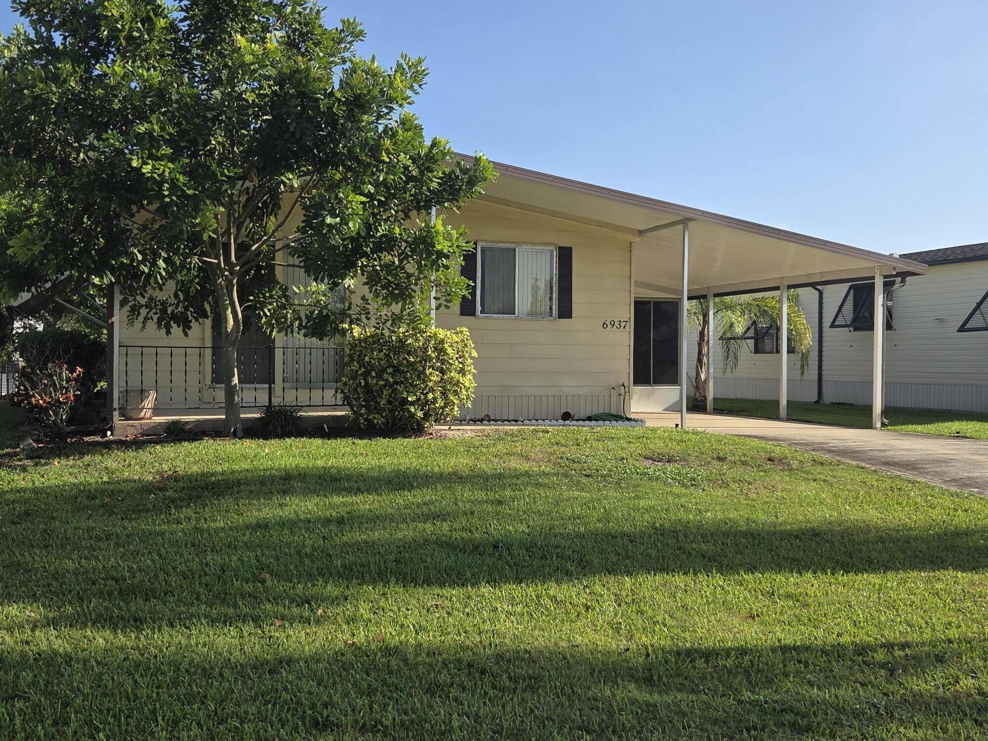Imagine a cozy, breezy manufactured home, just around 1,326 square feet. It's got two bedrooms, two bathrooms, and it's partially furnished, which is nice because you can add your own touches. You actually own the land too,not a lot lease. And the vibe is just really relaxed. You get these nice breezes from the intracoastal waterway and the beaches nearby. Plus, it's super convenient. There's shopping, medical facilities, restaurants, and I-95 all within easy reach, and you're just about 40 minutes from PBI. The community itself is super welcoming—very dog-friendly, people-friendly vibe. They've got an active clubhouse, a heated pool, shuffleboard, billiards, and a library, so there's always something to do. It's  a lovely, easygoing place to be!