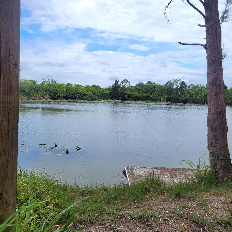 Motivated Seller!  This property is an excellent opportunity to own 12.2 acres, in Hobe Sound Fl.  This property is located 3.8 miles to Hobe Sound Public Beach and 1.8 miles to nearby shopping and approximate 3 miles to I-95.  This piece adjacent to Kitching Creek Preserve on 2 sides which boast wonder fishing and serenity.  The property has 2 large lakes keeping it high and dry.  It also boast large metal building, an 1853 sf home, and a pole barn.  Bring your toys, horses, livestock, and imagination.
