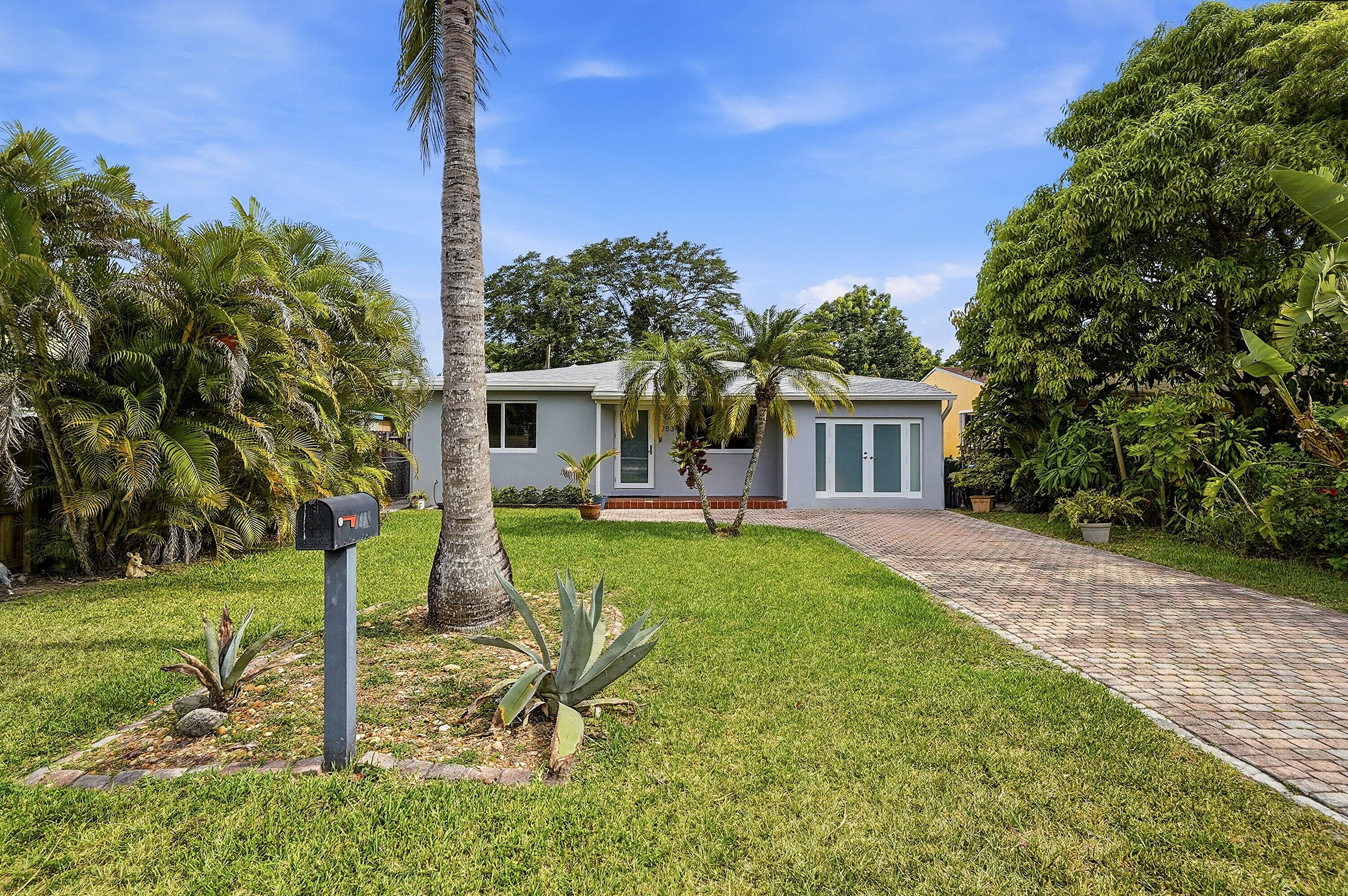 Welcome to this charming three-bedroom, two-bathroom single-family residence nestled in the Hollywood Little Ranches community in Hollywood, Florida. This one-story home offers ample finished living space, a split floor plan providing comfortable and functional accommodations. The thoughtful layout with three bedrooms and two full baths makes efficient use of the available square footage for everyday living, while still offering a workshop and gorgeous outdoor hosting area - completely screened in. Situated centrally, this property makes all you could need easily accessible - downtown, highways, beaches, shopping, train stations and airports. This presents an excellent opportunity for anyone looking for their South Florida dream home. Full photos and floor plan coming June 19th. Please schedule appointments with Showing Time.