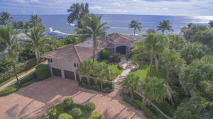 Panorama ocean views from the moment you enter. Shadows of 1950 still remain in this unique oceanfront home. Originally owned by Perry Como, he always called it his little slice of paradise.  The original safari room still remains. Beamed ceilings in the fourth bedroom suite with breakfast bar. Master suite offers sitting room, his and her baths, Original wall to wall Hollywood style closets.  Extremely spacious rooms, large entry foyer, formal living room & dining room. Many updates include kitchen, master baths, hurricane impact windows, and front exterior. Located in an amazing seaside community of Jupiter Inlet Colony on the southern end of Jupiter Island.