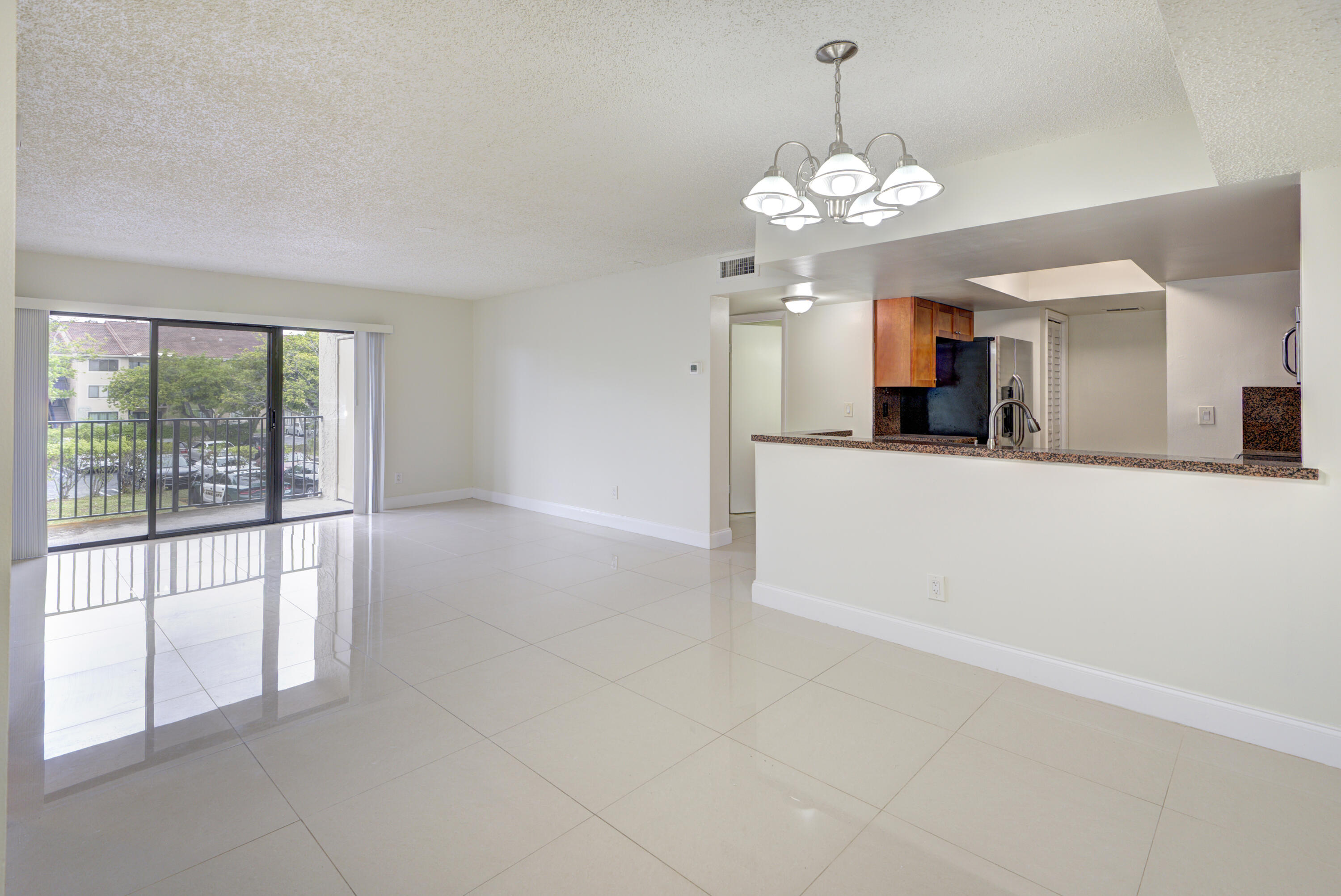 lean and bright 2 bedroom, 2 bathroom unit on the second floor. This spacious condo is located in the gated community of Visconti. Updated kitchen with stainless steel appliances and granite counters, large tile flooring in the common areas and laminate in the bedrooms, updated bathrooms with newer vanities, toilets and fixtures. Washer and dryer located in the unit. Open patio with storage closet. Amazing location and close to everything: minutes to I-75, I-595, across the street from Coral Square Mall, near entertainment, shopping, & restaurants. Visconti Condominiums is a high end gated community with many amenities: 2 swimming pools, a fitness center, clubhouse, tennis courts, play area, car wash area, dog park, and peaceful walking paths.