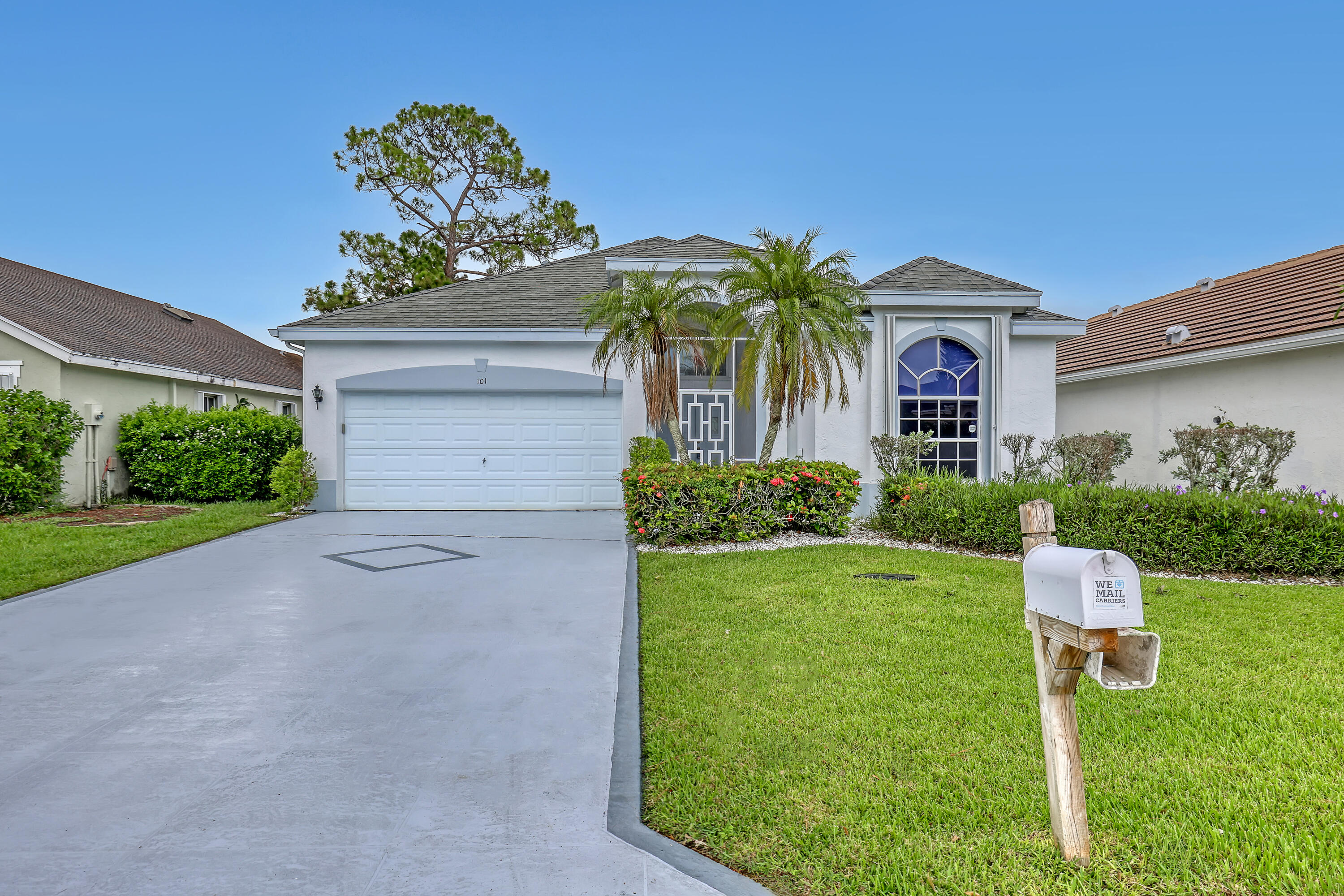 Looking for breathtaking water views and low HOA fees? Your search ends here! This CBS home offers 3 bedrooms, 2 baths, and a 2-car garage with a desirable split-bedroom floor plan designed for both comfort and privacy. The spacious layout features formal living and dining rooms, a welcoming family room, and a bright, open kitchen overlooking the main living areas—perfect for everyday living and entertaining. Open the sliding glass doors from both the living and family rooms and step onto the covered, screened patio, where you can relax with peaceful water views while enjoying the best of Florida's indoor-outdoor lifestyle. The oversized screened lanai offers plenty of room for outdoor dining, lounging, or entertaining. Situated on a large lot, there's plenty of room for children to play,  pets to roam, or to create the garden you've always dreamed of. While the home could benefit from some personal updates, it offers a wonderful opportunity to add your own style and make it truly your own. Enjoy added peace of mind with a 2021 Generac whole-house generator and hurricane accordion shutters for storm protection. Additional features include an interior laundry room, vaulted ceilings, a welcoming foyer, and abundant natural light throughout. Ideally located within walking distance of H.L. Johnson Elementary School and just a short drive to Palm Beach International Airport, shopping, dining, parks, and major highways, this home combines a beautiful setting with everyday convenience. The community offers tennis courts and pool for enjoyment.  Bring your decorating ideas, add your personal touches, and transform this waterfront property into the home you've always envisioned! Professional photos coming soon